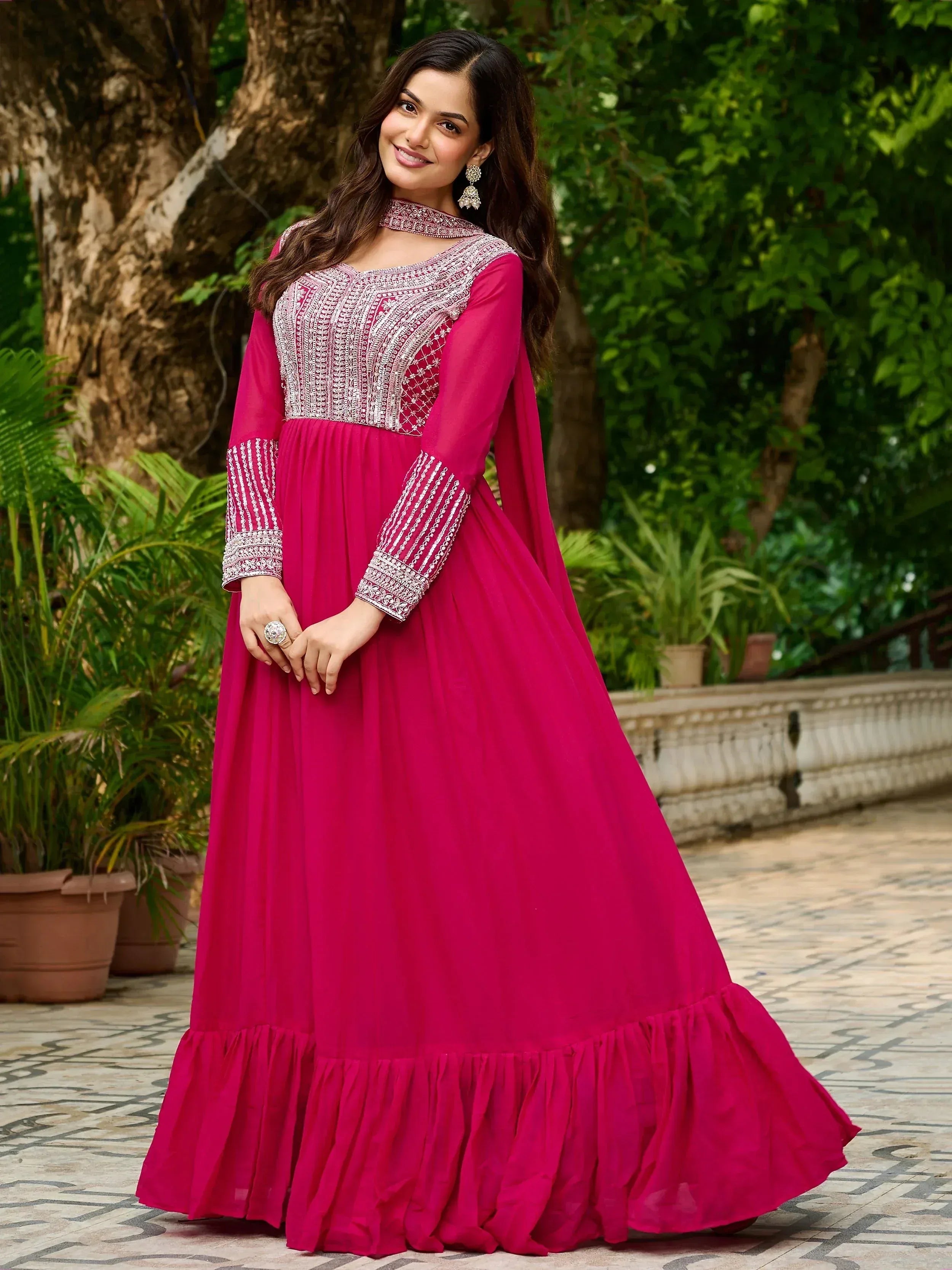 Pink ethnic gown with silver embroidery, long sleeves, and ruffled hem for women
