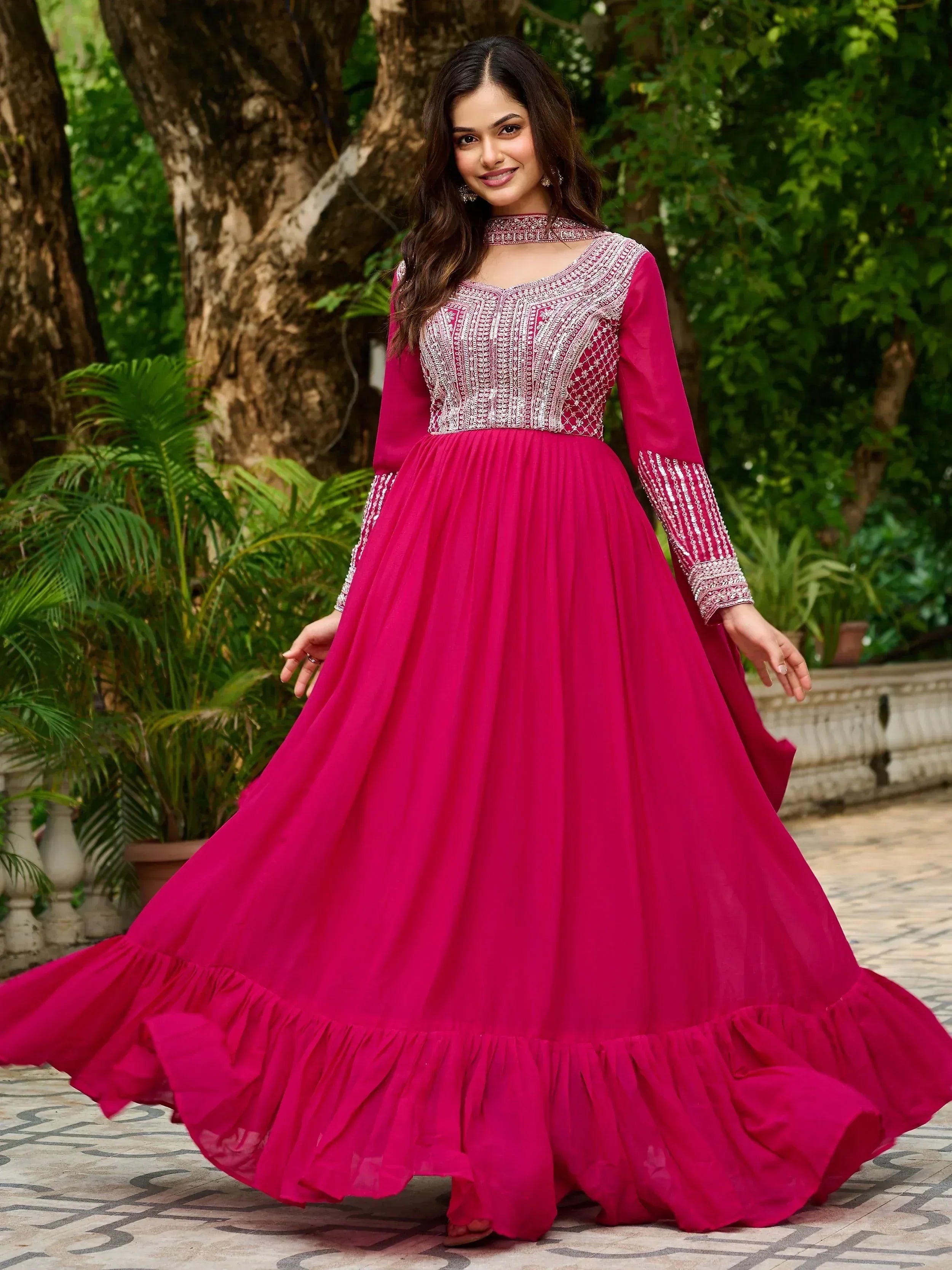 Fuchsia ethnic gown with silver embroidery, perfect for Indian occasions and festive wear.