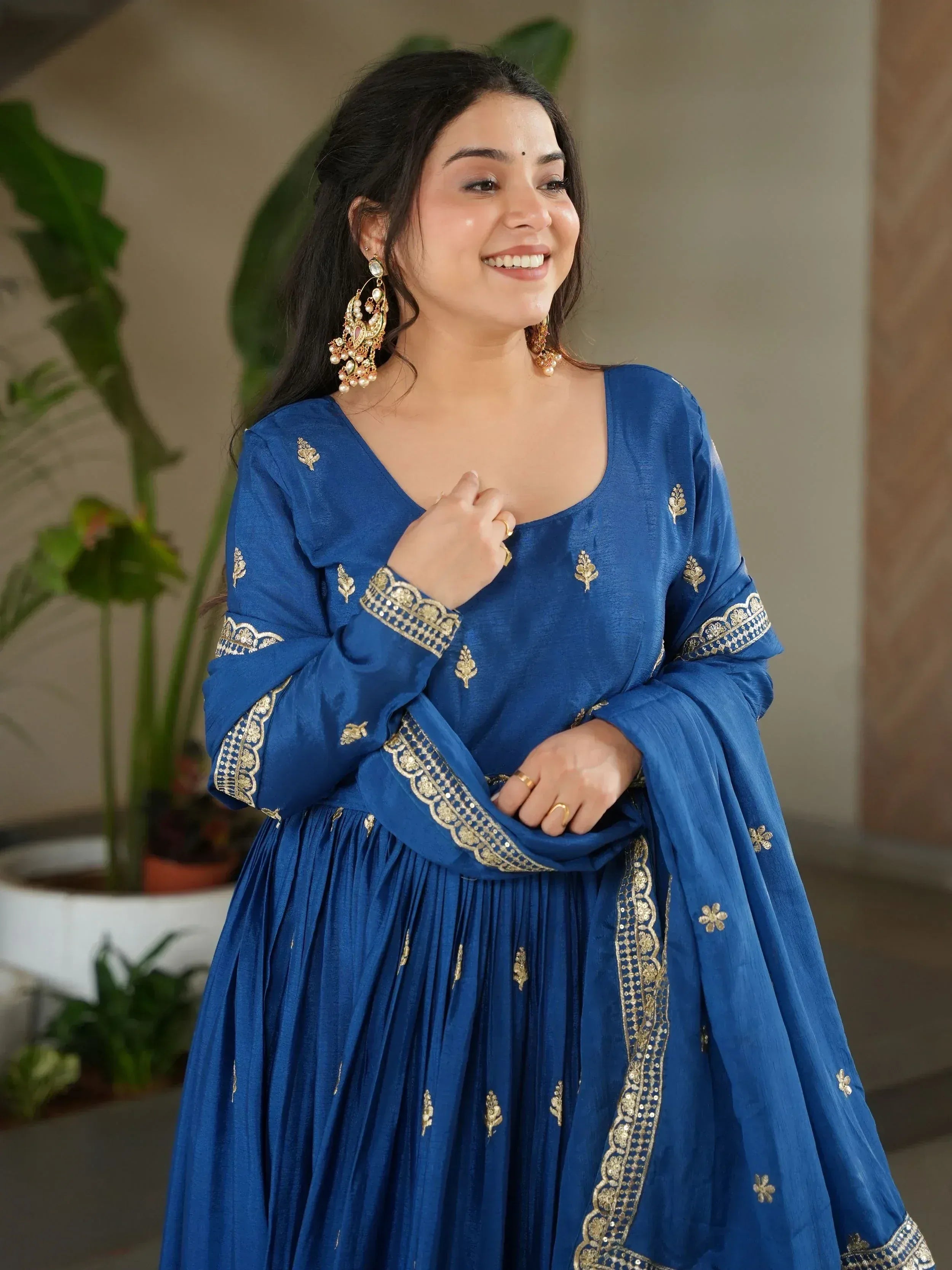 Blue ethnic gown with gold embroidery, perfect for Indian occasions and festive wear