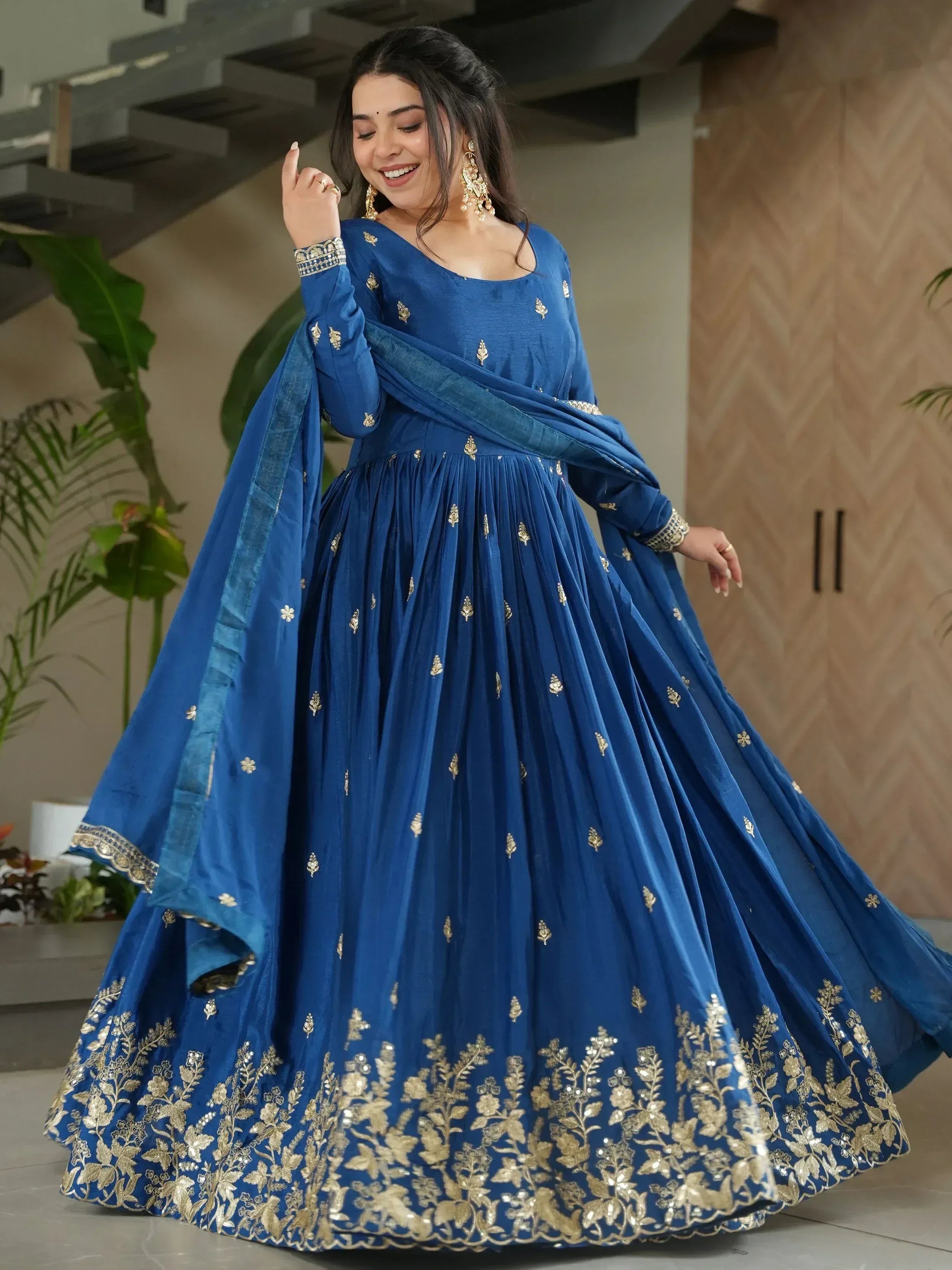 Royal blue designer anarkali with gold embroidery, perfect for Indian ethnic wear and festive occasions.