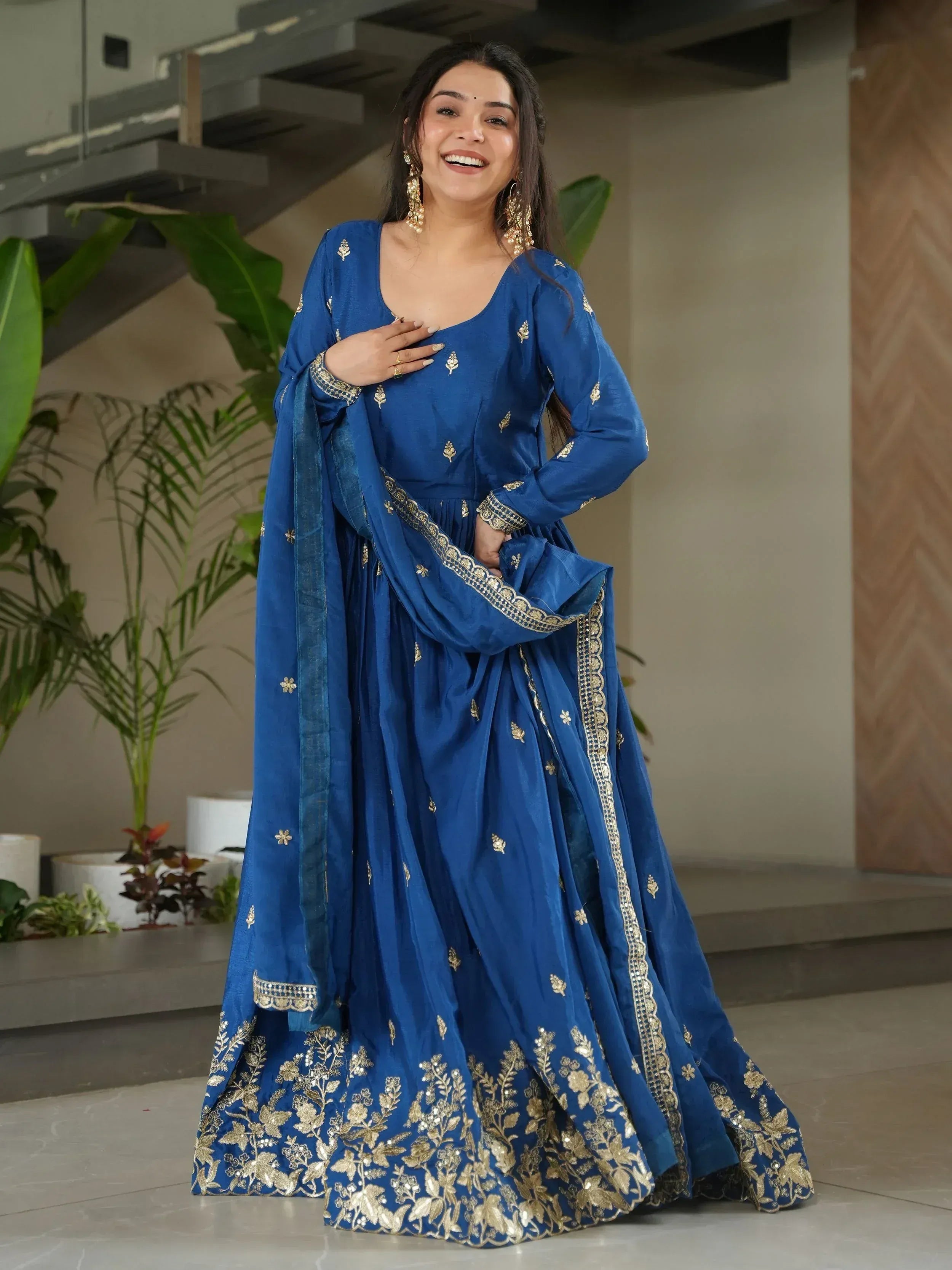 Blue ethnic anarkali with gold embroidery, perfect for Indian weddings and festive occasions