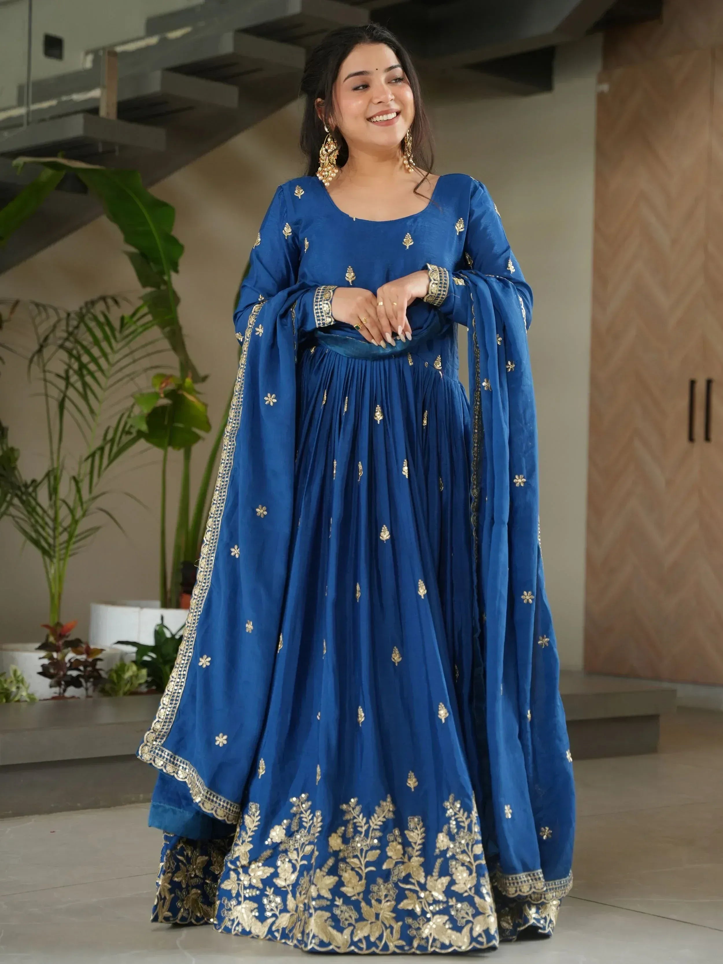 Royal blue ethnic anarkali with gold embroidery, perfect for Indian weddings and festive occasions.