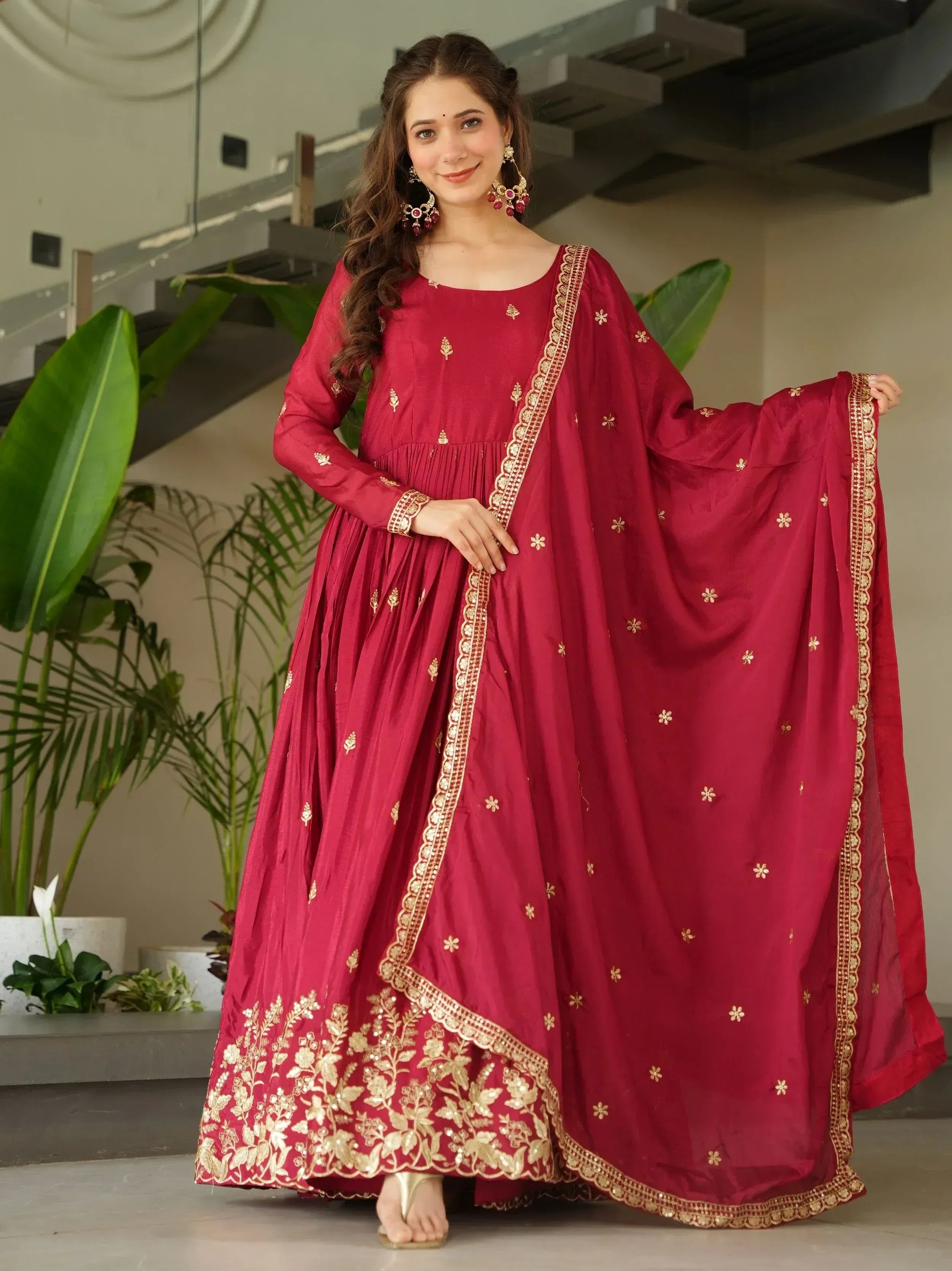 Maroon ethnic anarkali suit with gold embroidery, perfect for Indian weddings and festive occasions