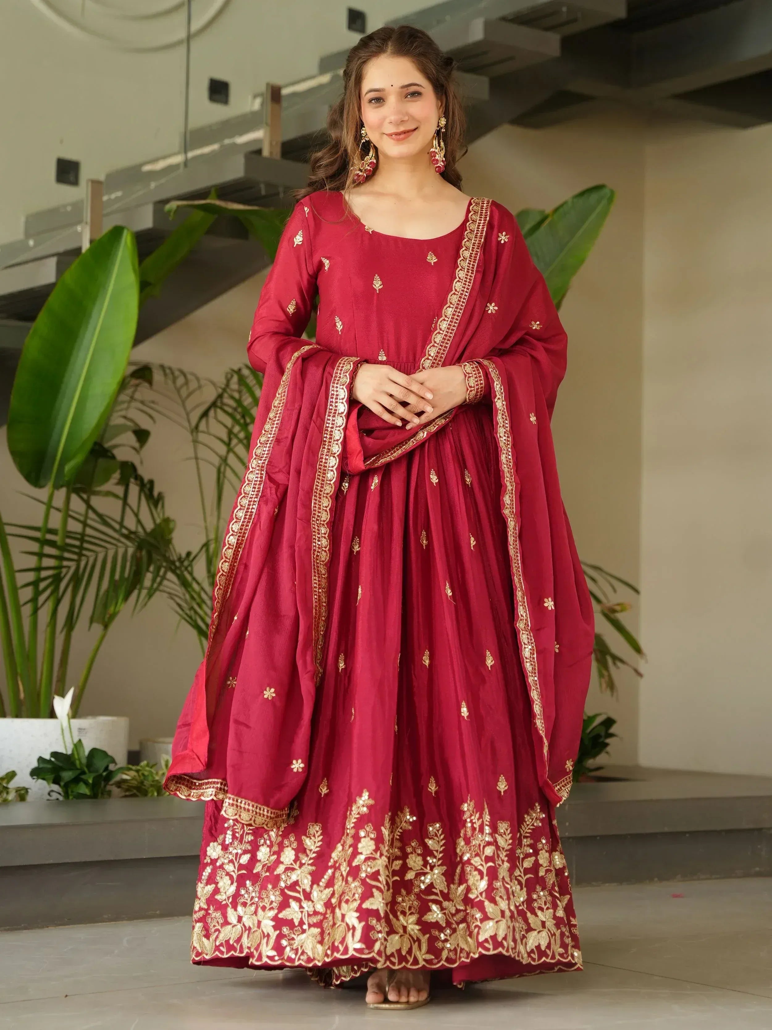 Maroon ethnic anarkali suit with gold embroidery, perfect for Indian weddings and festive occasions
