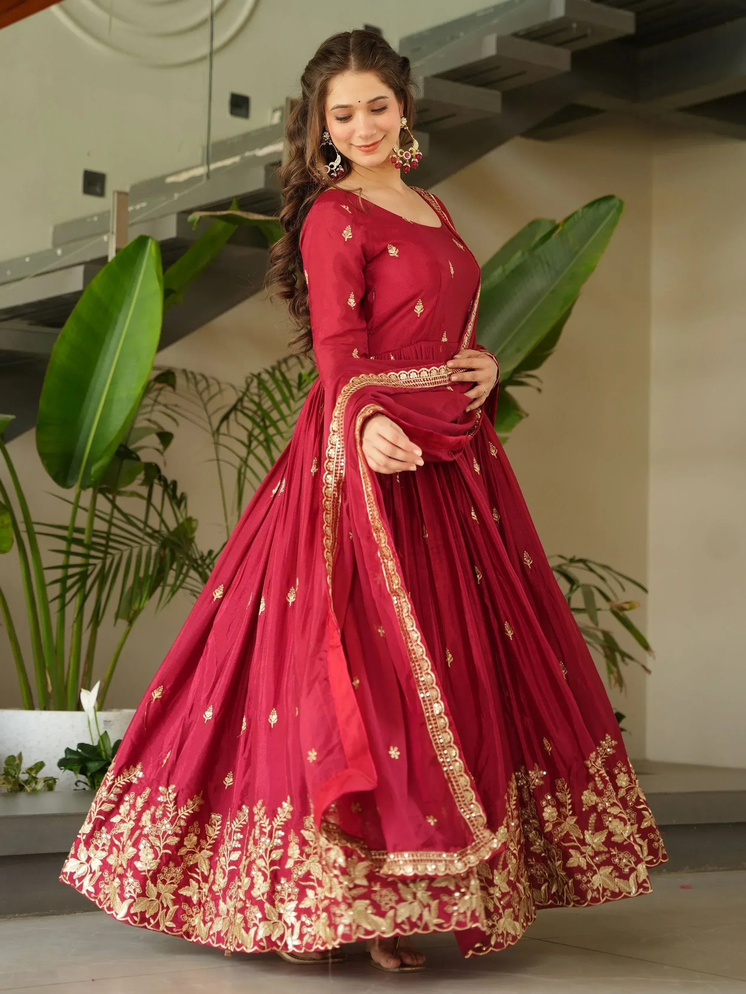 Maroon designer lehenga choli with gold embroidery, perfect for Indian ethnic wear and festive occasions.