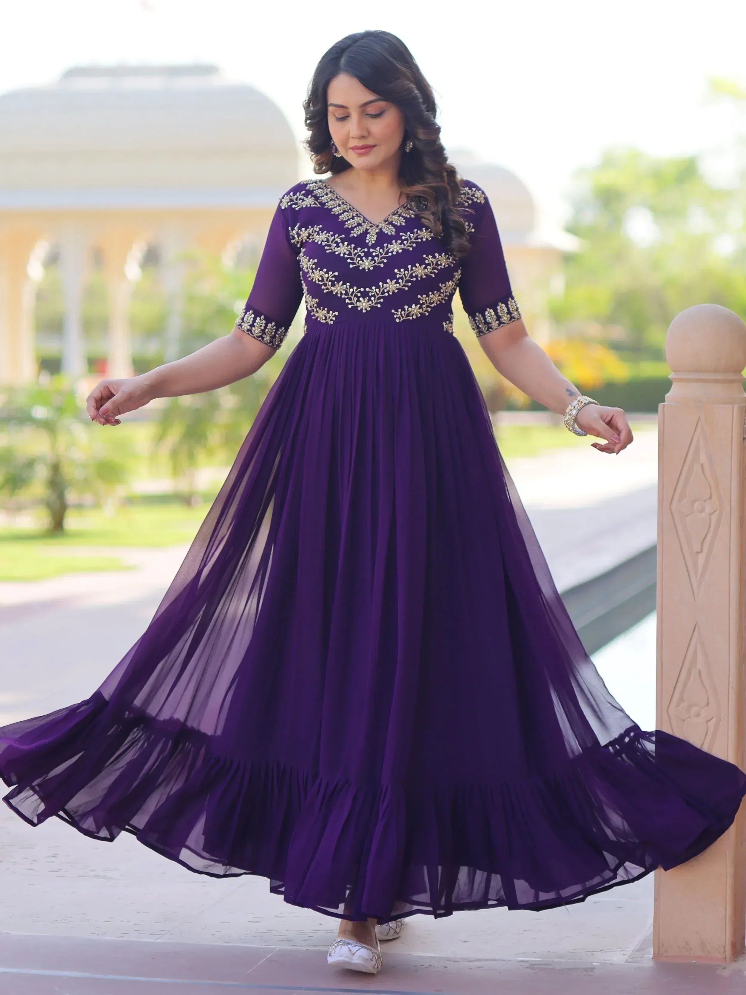 Purple ethnic gown with gold embroidery, perfect for Indian occasions and festive events.