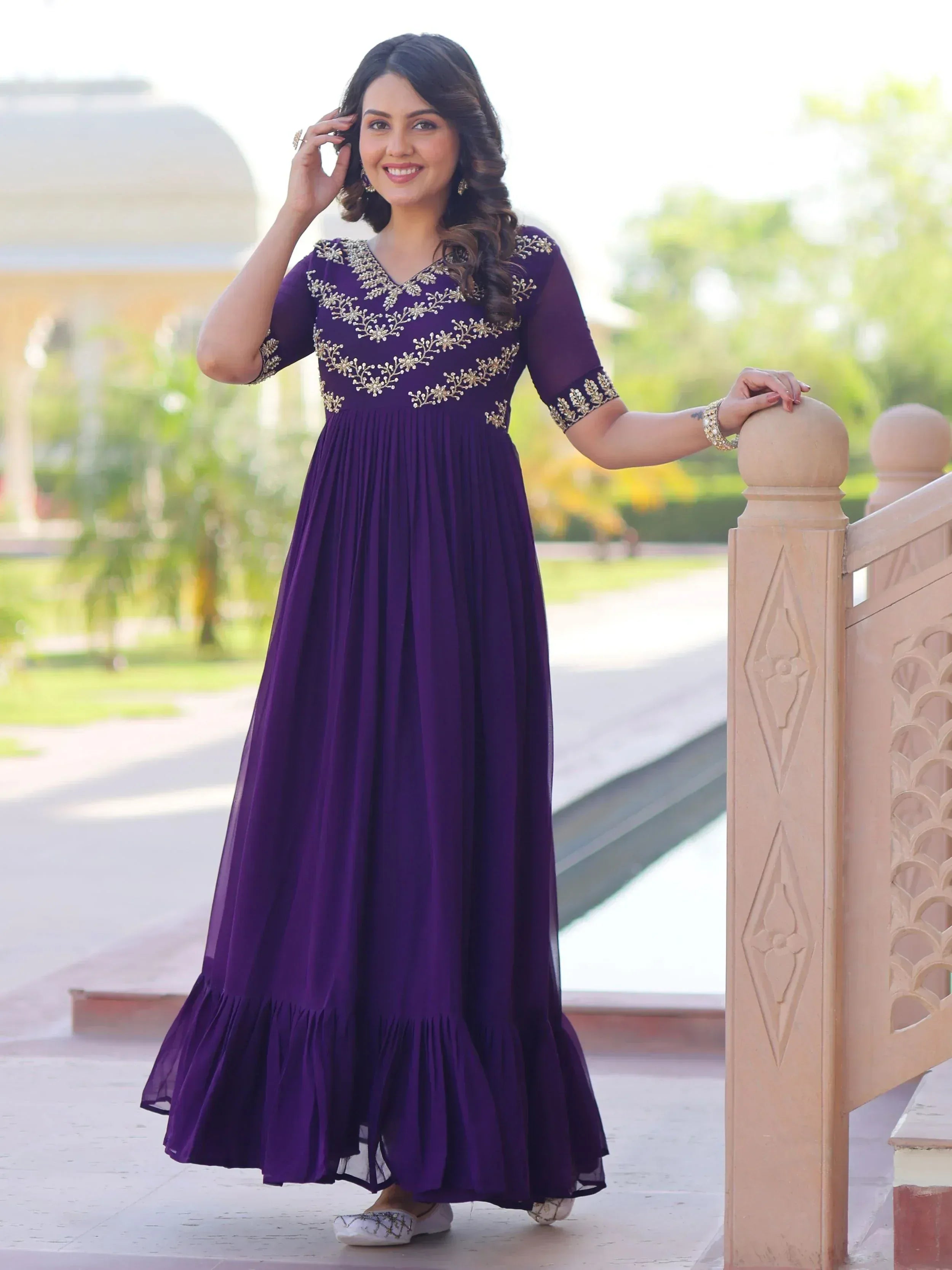 Purple ethnic gown with gold embroidery, perfect for Indian occasions and festive wear.