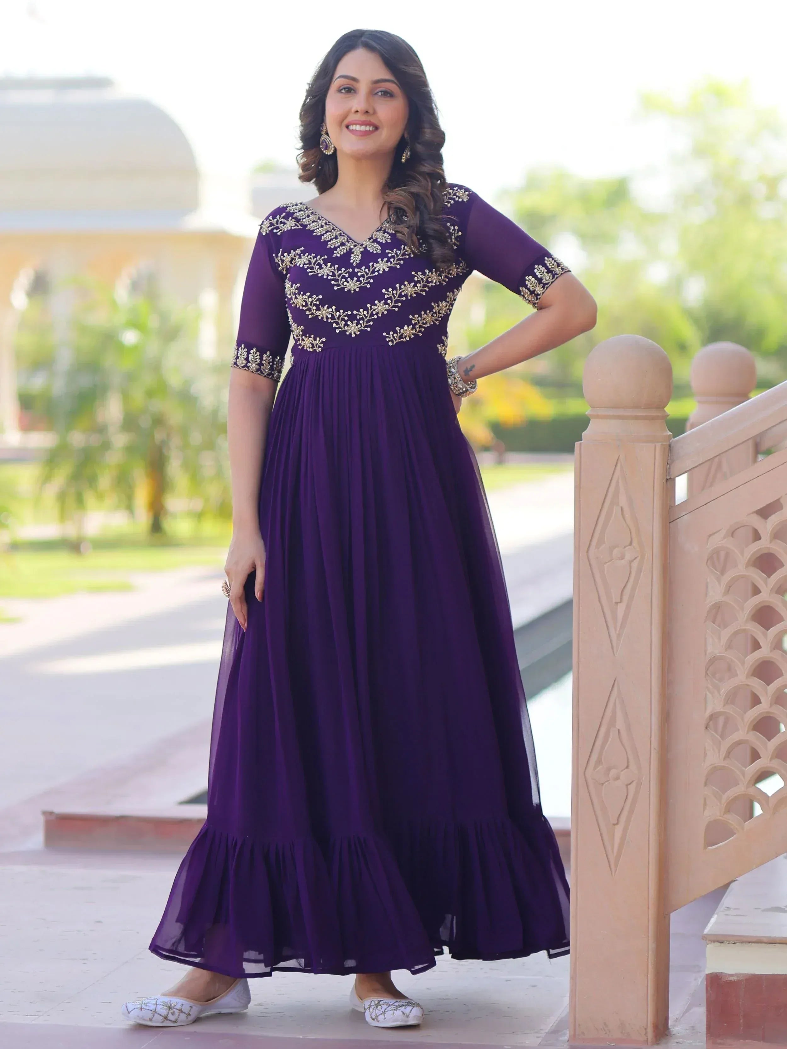 Purple ethnic gown with gold embroidery, perfect for Indian occasions and festive wear.