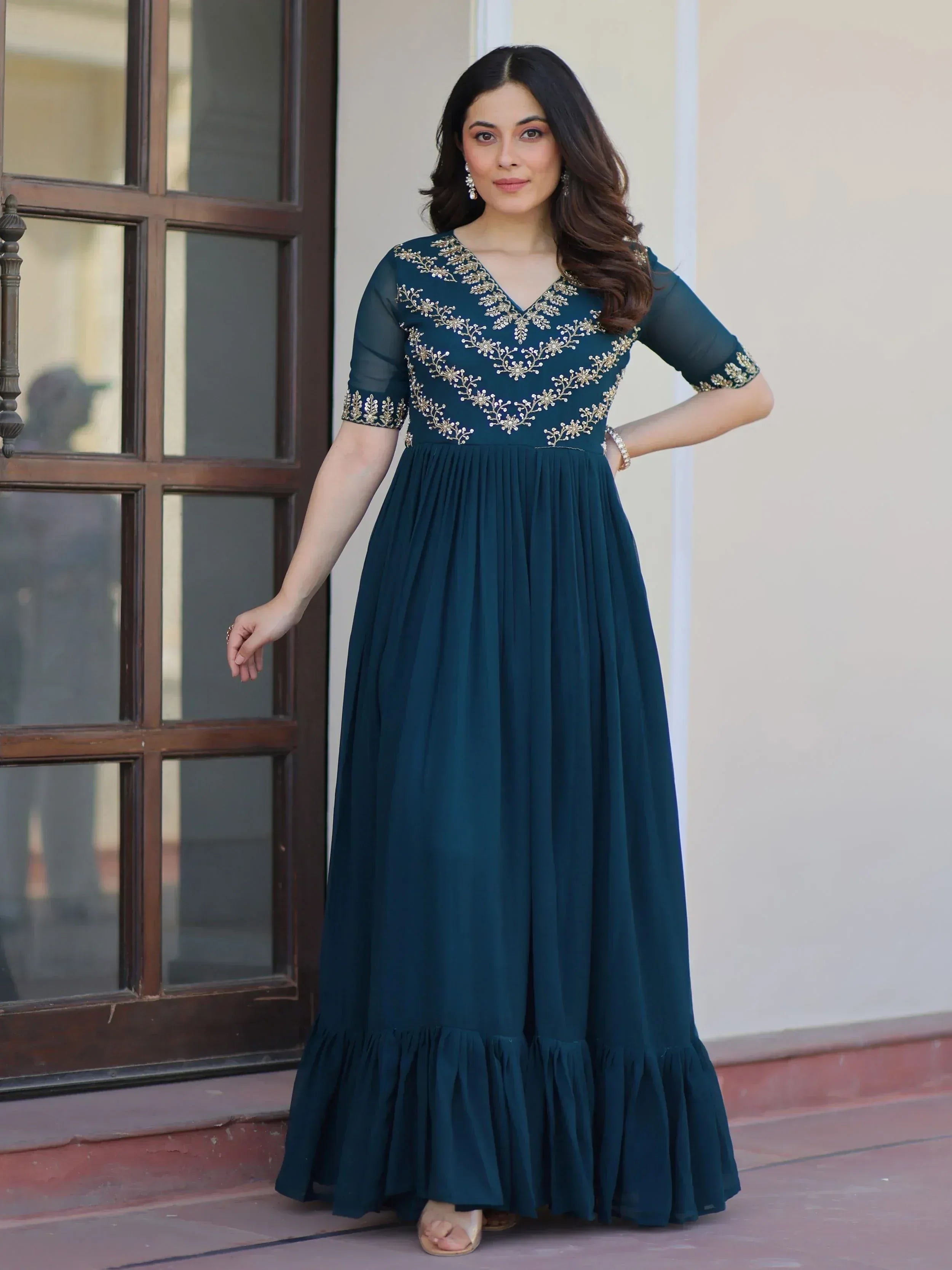 Teal ethnic gown with gold embroidery, V-neck, sheer sleeves, and flared skirt for women