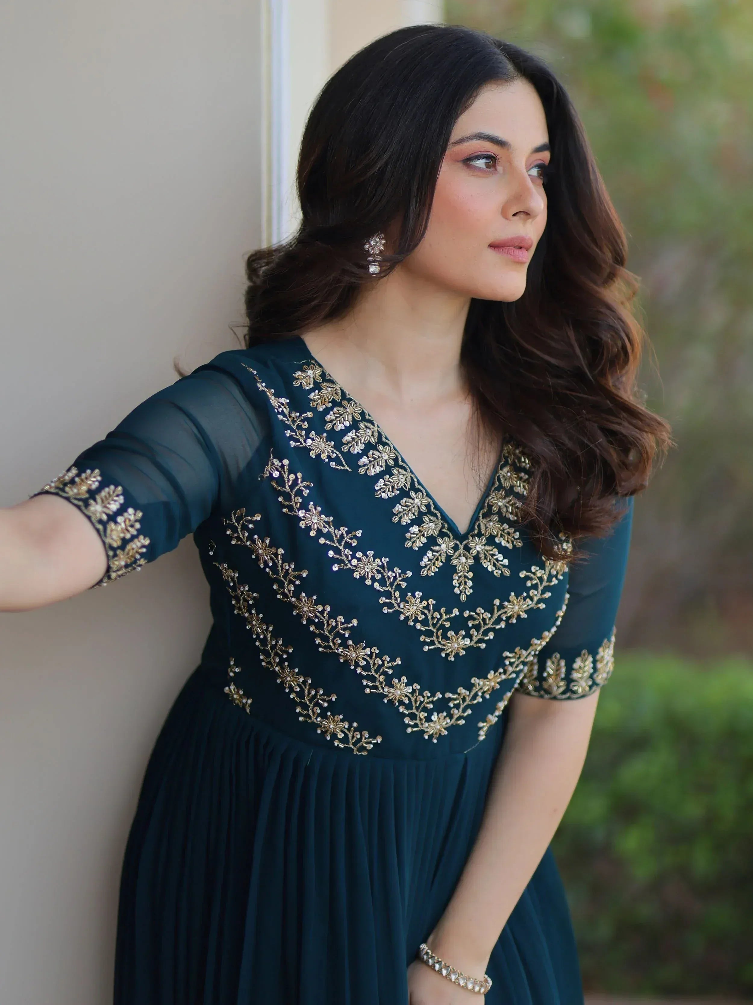 Teal ethnic gown with gold floral embroidery, perfect for Indian occasions and festive wear