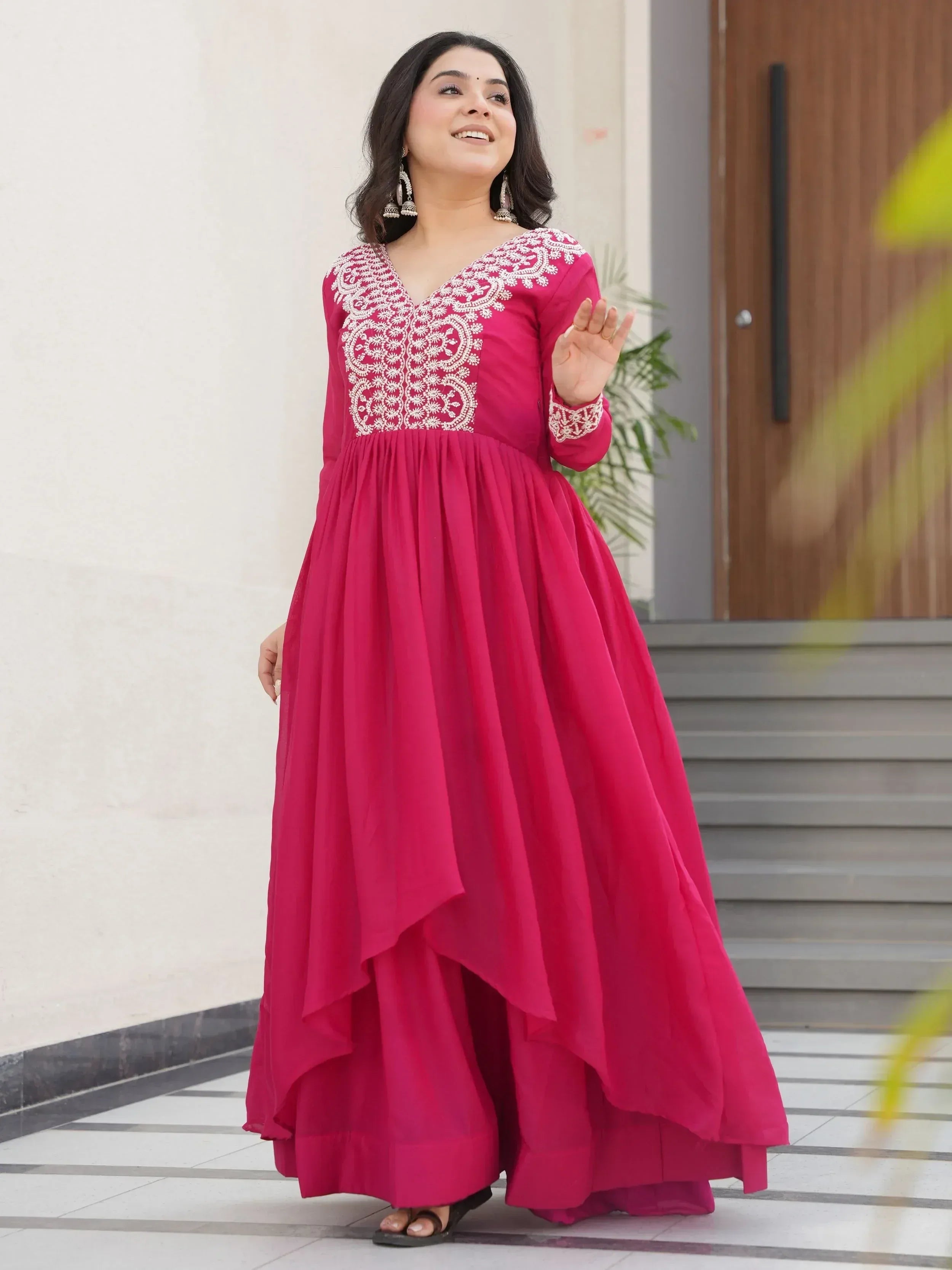 Pink ethnic gown with white embroidery, perfect for Indian occasions and festive wear.