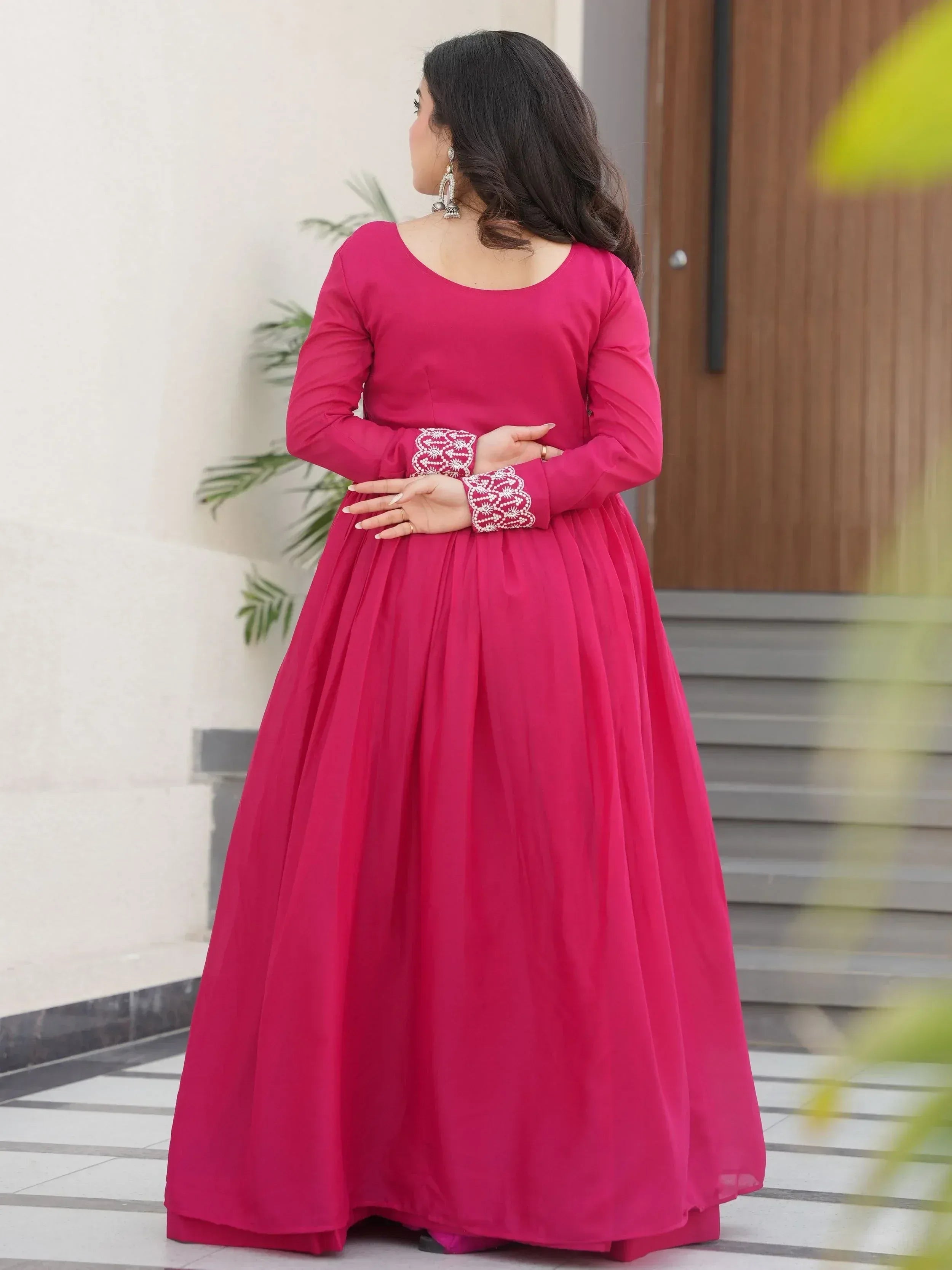 Pink ethnic gown with embroidered sleeves, perfect for Indian occasions and festive wear