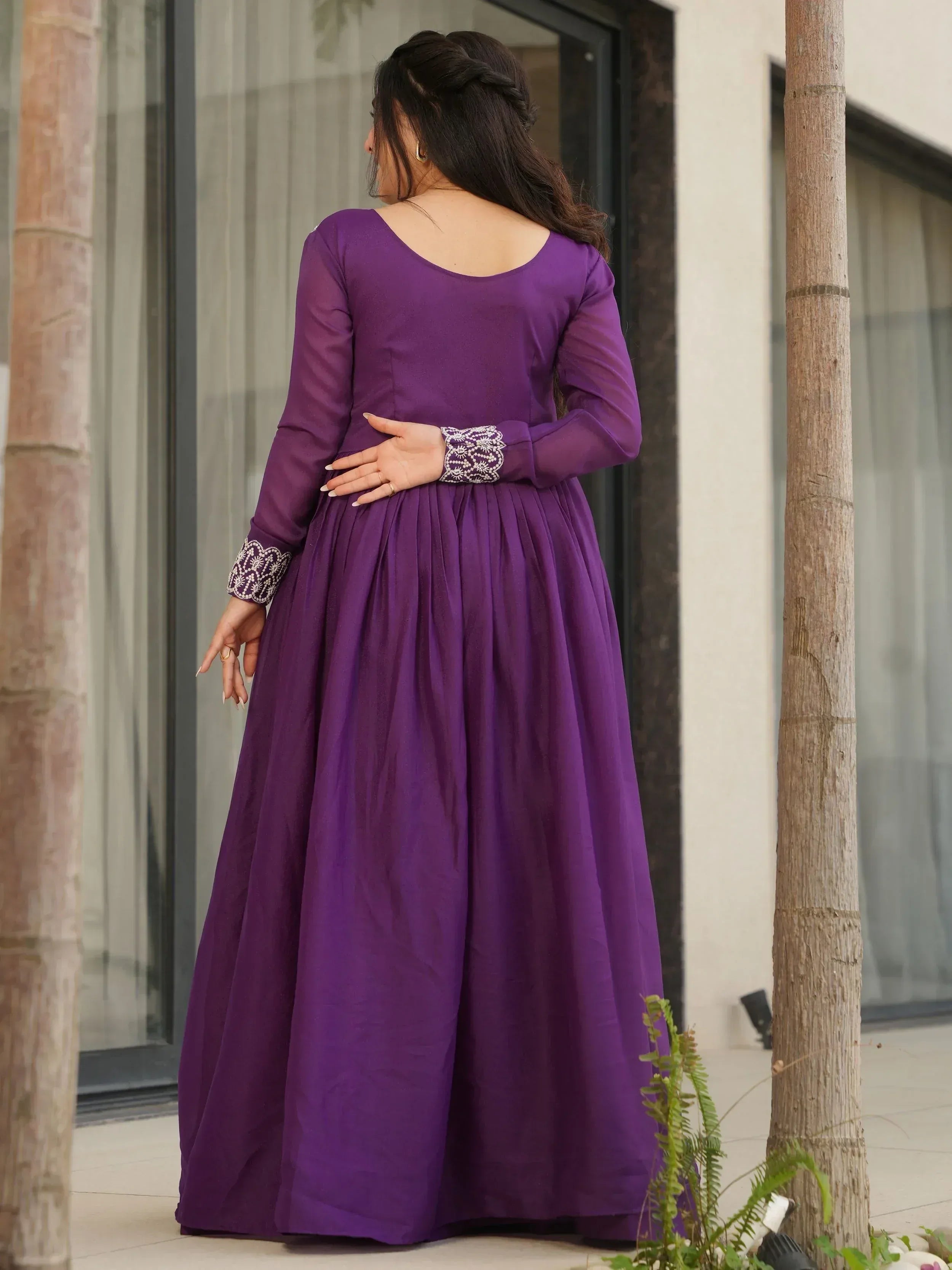 Purple ethnic gown with embroidered sleeves, perfect for Indian occasions and festive wear.