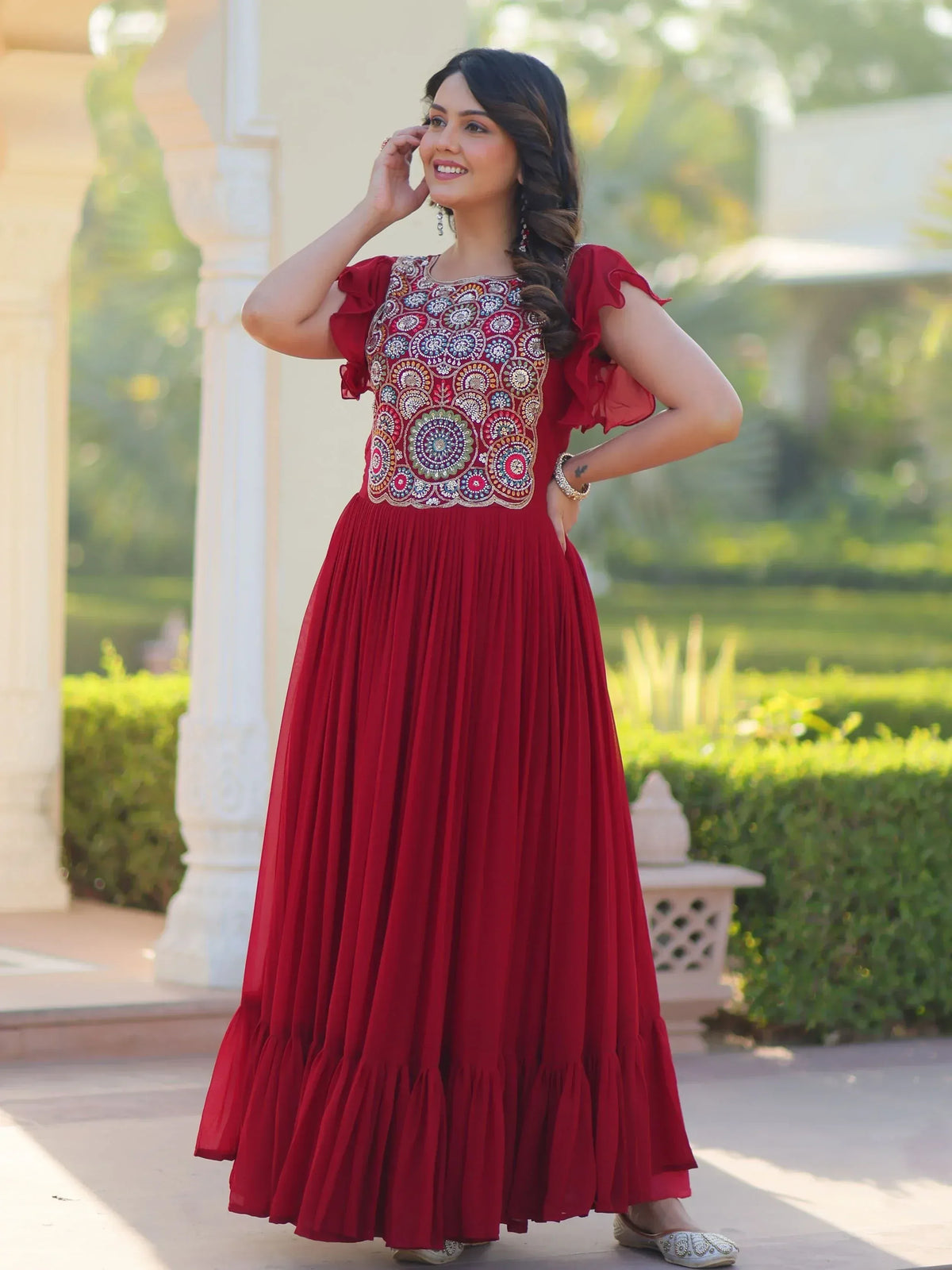 Red ethnic gown with intricate embroidery, perfect for Indian celebrations and festive occasions.