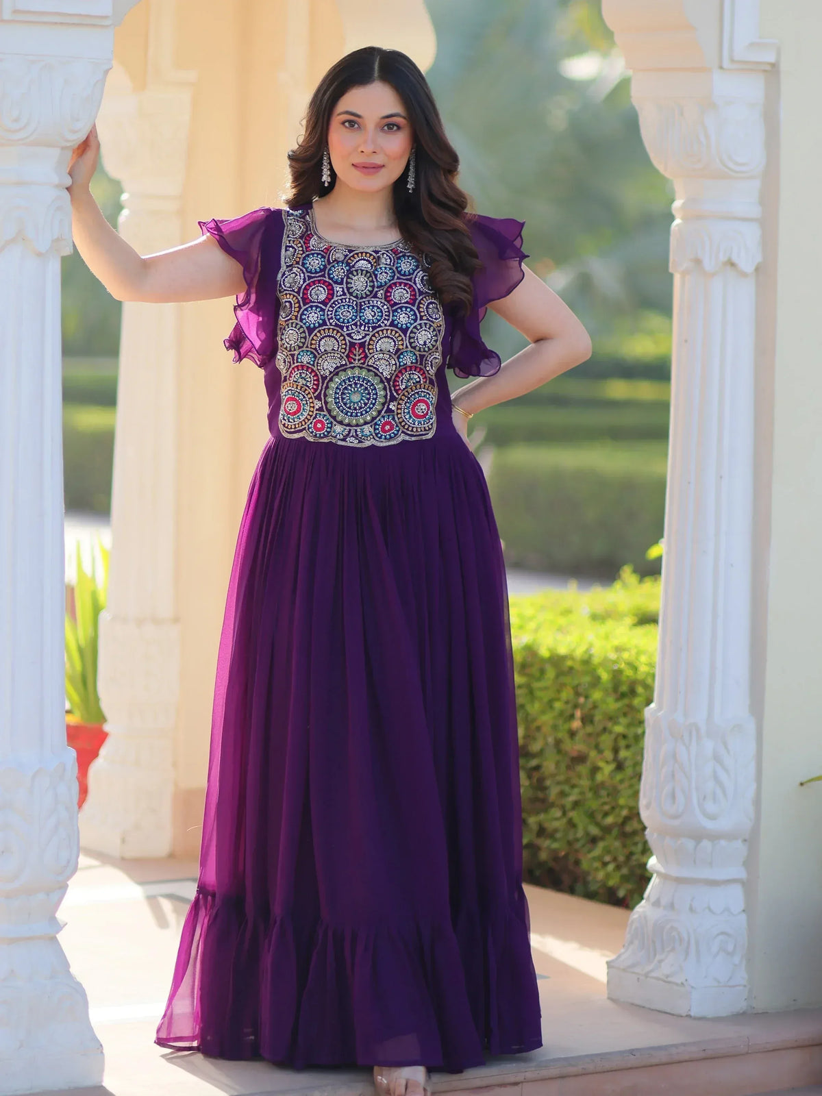 Purple ethnic gown with floral embroidery, ruffled sleeves, and pleated skirt for Indian occasions