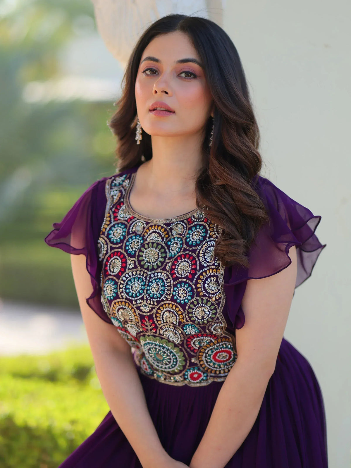 Purple ethnic gown with colorful floral embroidery, ruffled sleeves, perfect for Indian festive occasions