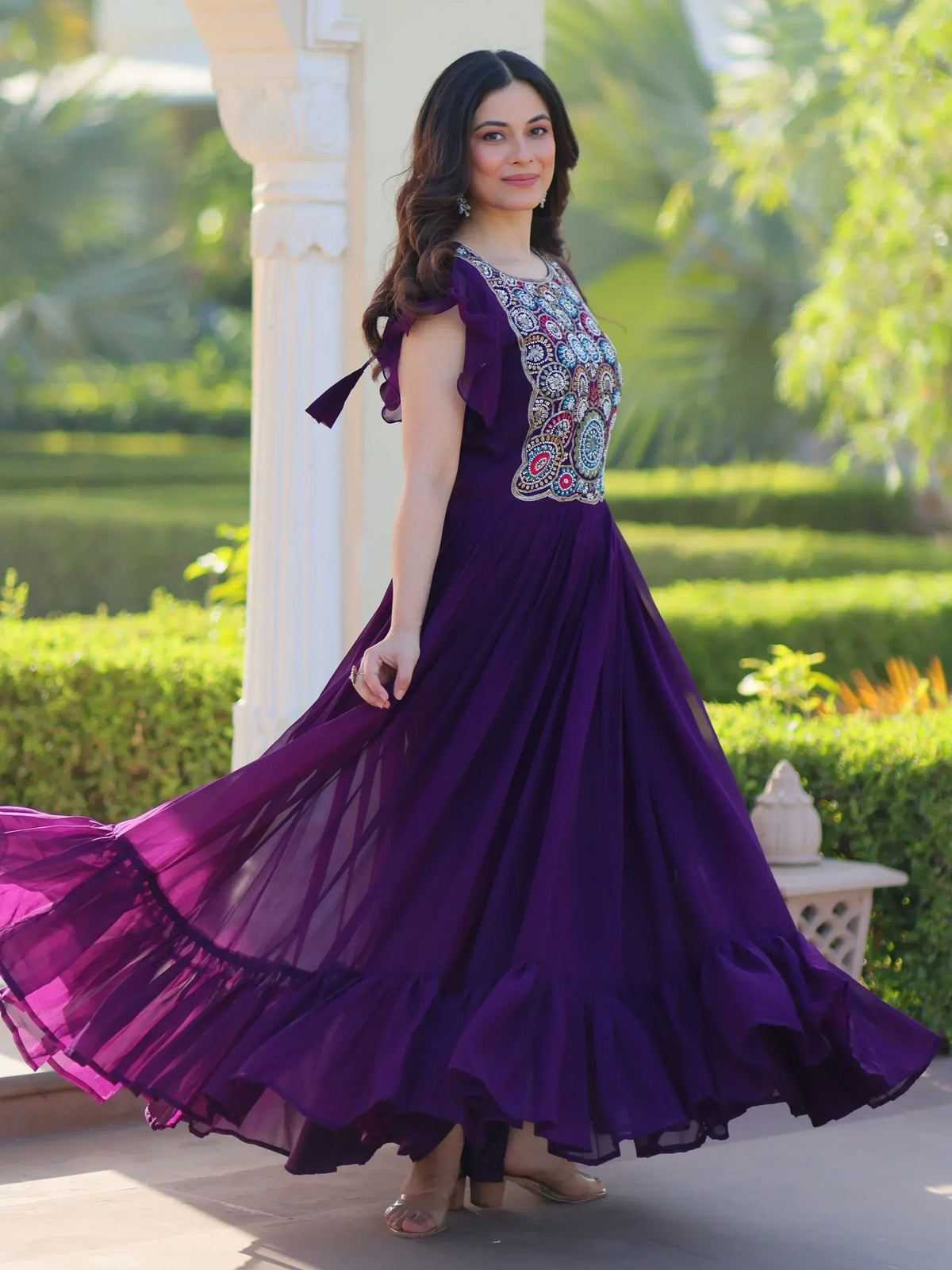 Purple ethnic gown with colorful embroidery and ruffled sleeves, perfect for Indian occasions