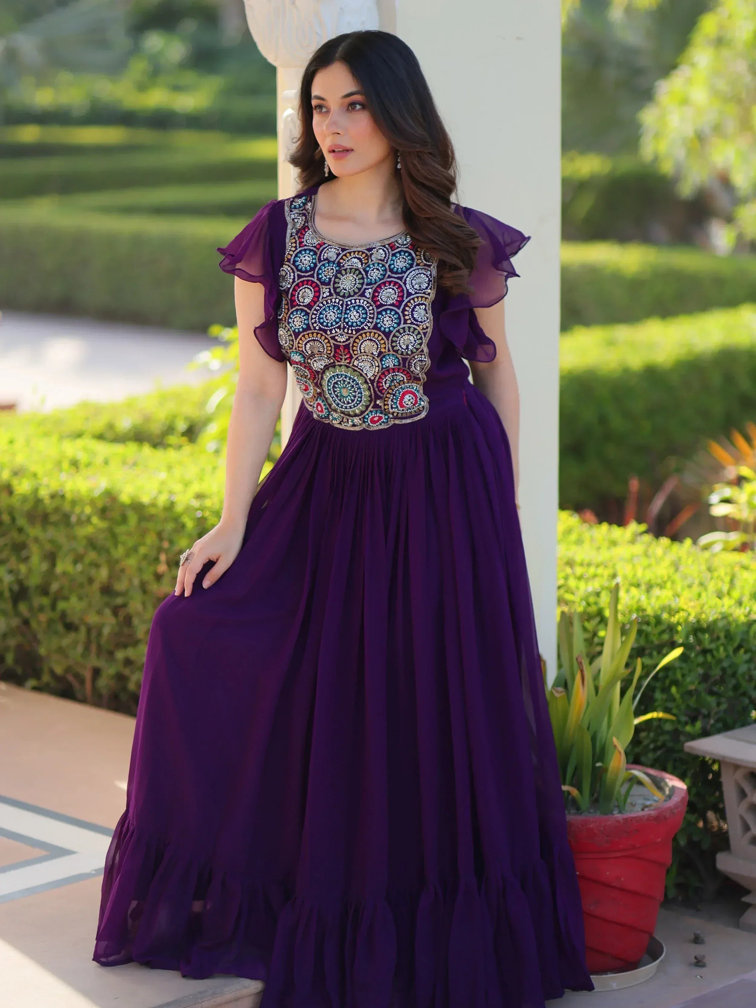 Purple ethnic gown with floral embroidery, ruffle sleeves, and pleated skirt for Indian occasions