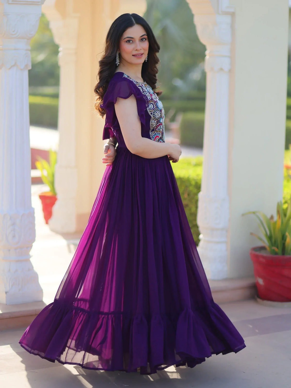 Purple ethnic gown with ruffle sleeves and embroidered bodice, perfect for Indian weddings or parties