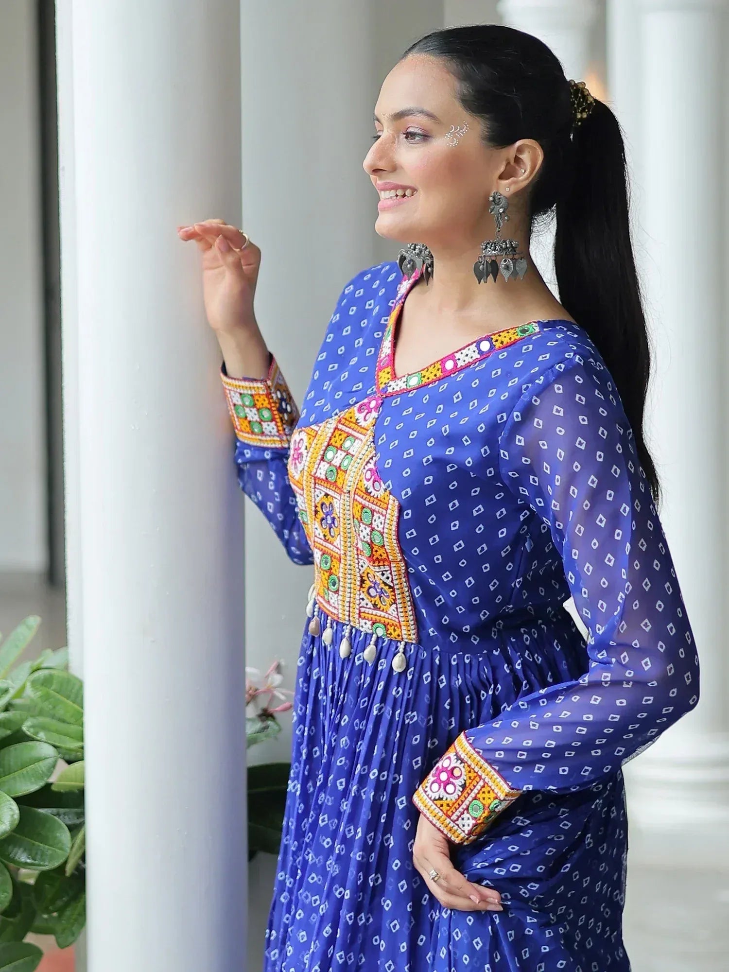 Blue ethnic gown with colorful embroidery, perfect for Indian festive wear and designer occasions.