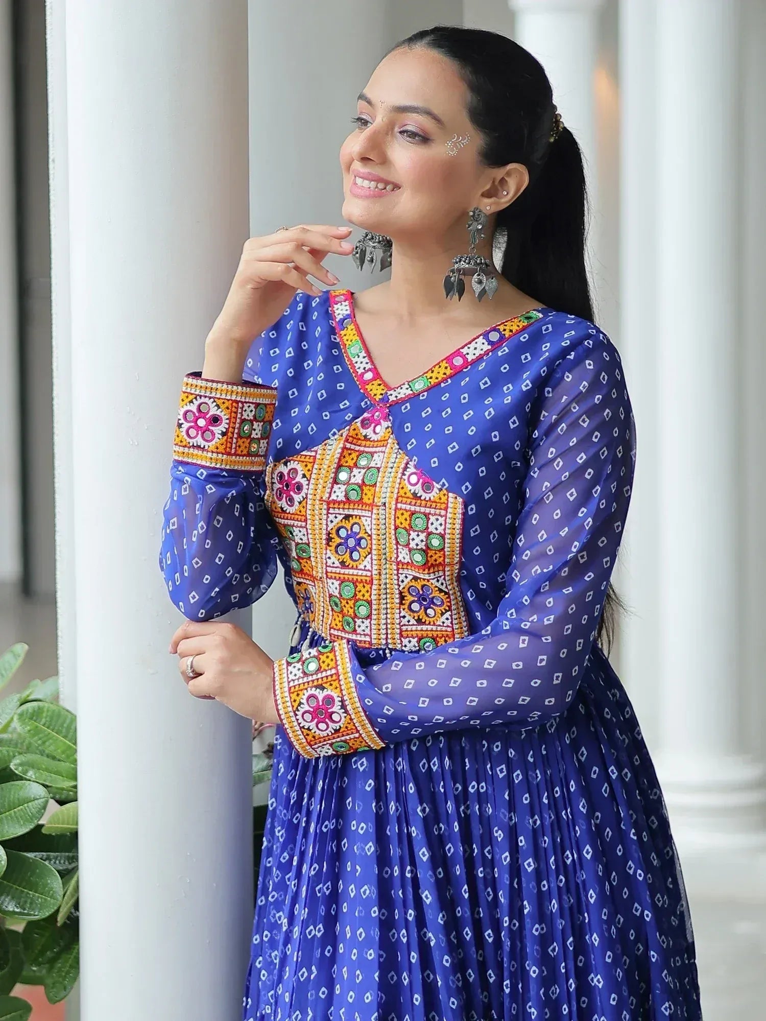 Blue embroidered ethnic gown with colorful mirror work, perfect for Indian festive occasions