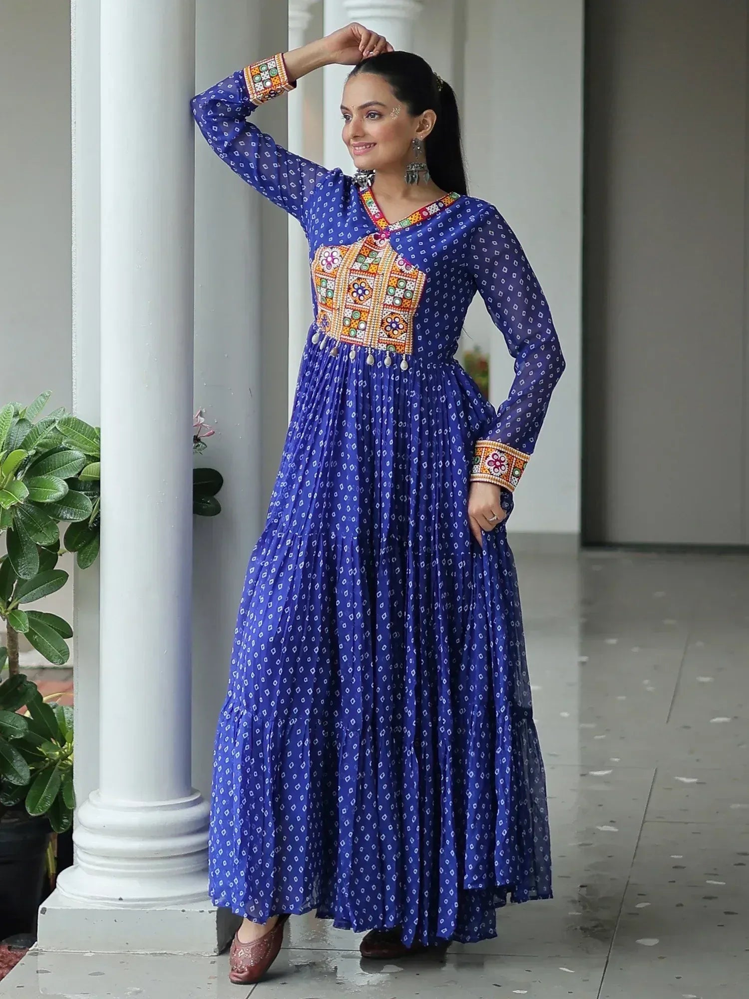 Blue ethnic gown with colorful embroidery, perfect for Indian festive wear and designer occasions.