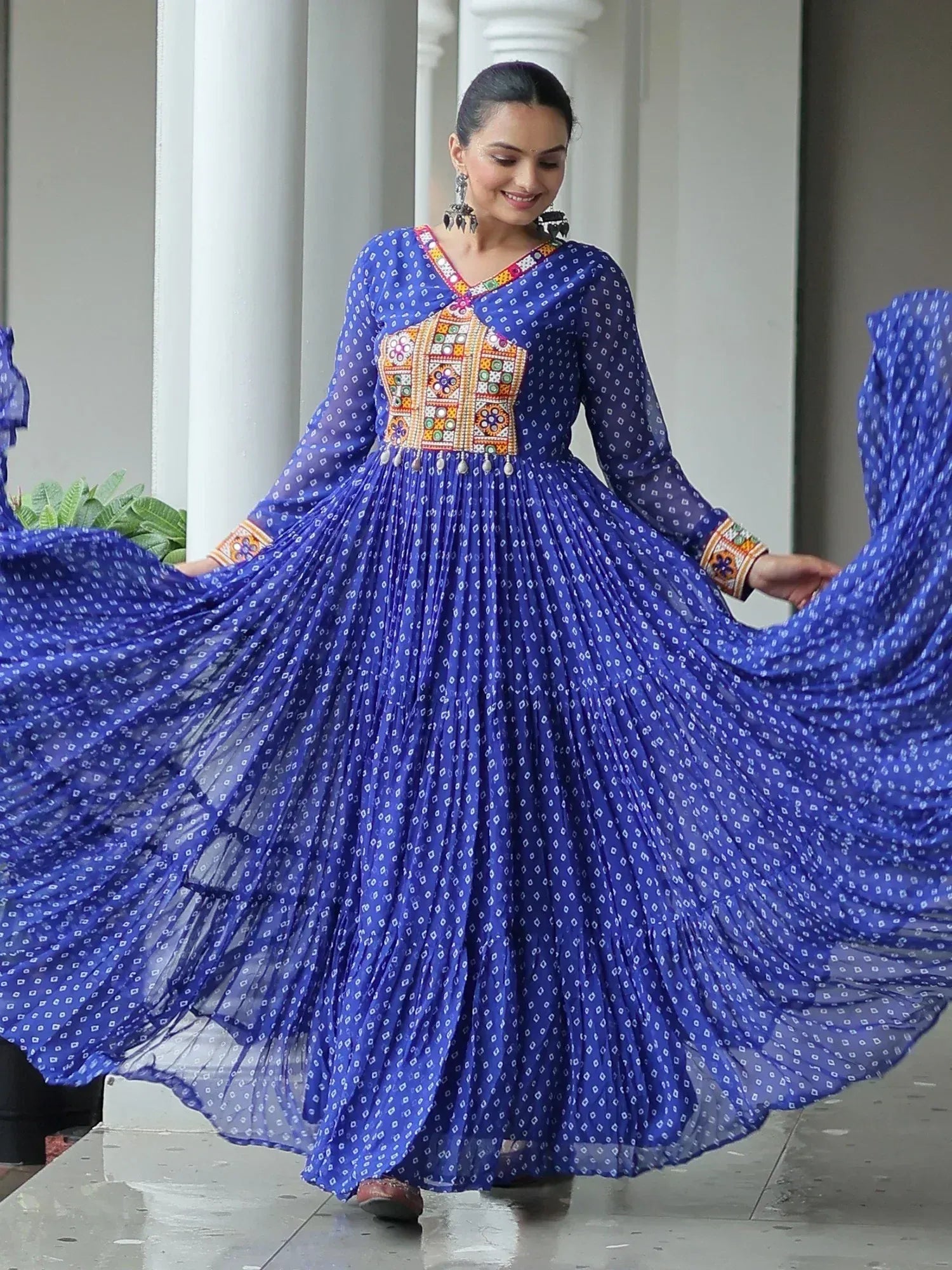 Blue ethnic gown with mirror work and printed pleats, perfect for Indian festive wear
