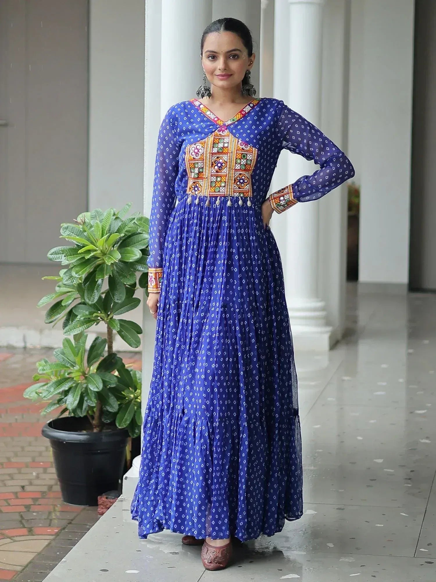 Blue ethnic gown with colorful embroidery and mirror work, perfect for Indian festive occasions