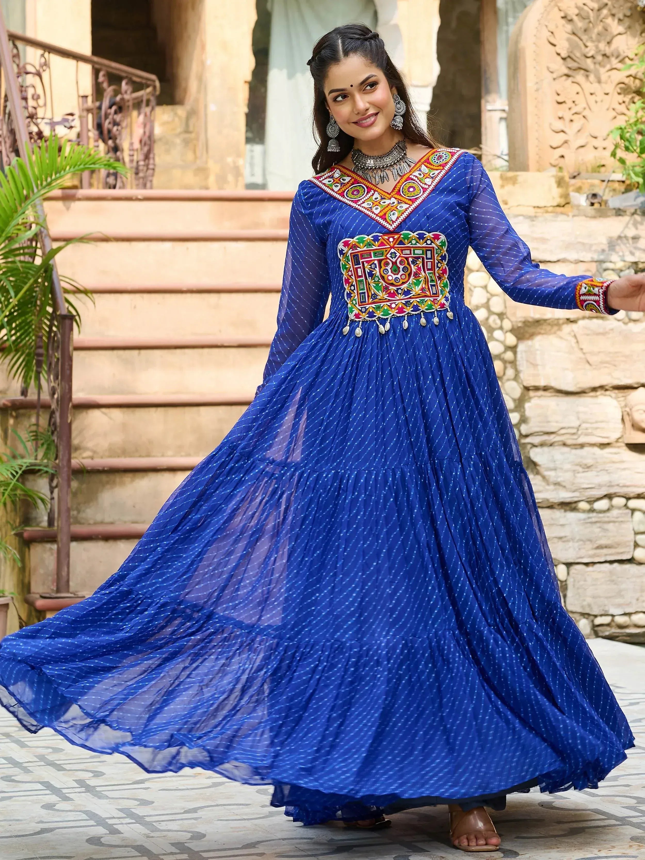 Blue ethnic gown with colorful mirror work, perfect for Indian festive occasions and weddings