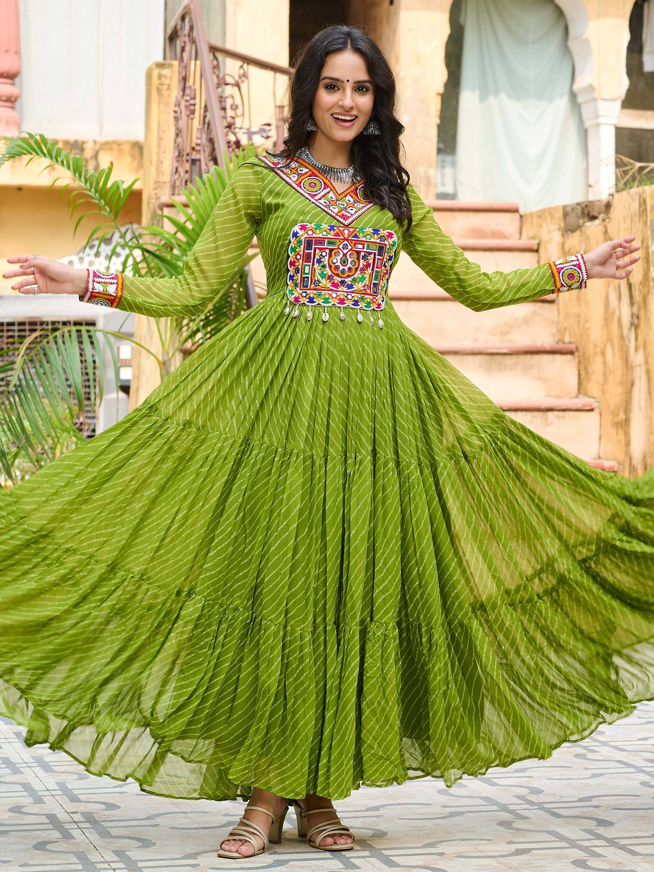 Green ethnic gown with colorful mirror work, perfect for Indian festivals and parties
