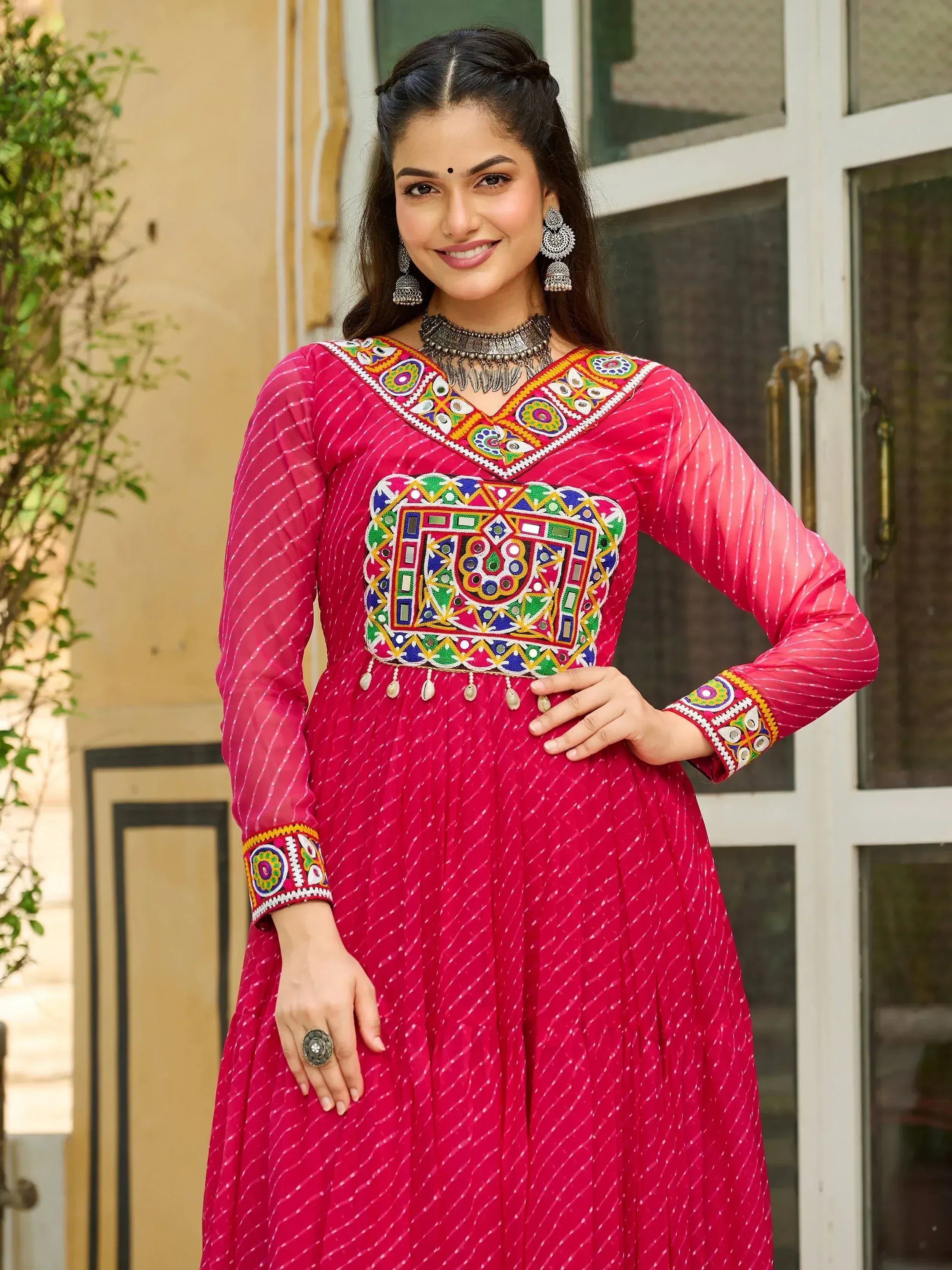Pink ethnic anarkali with mirror work and embroidery, perfect for Indian occasions and festive wear.