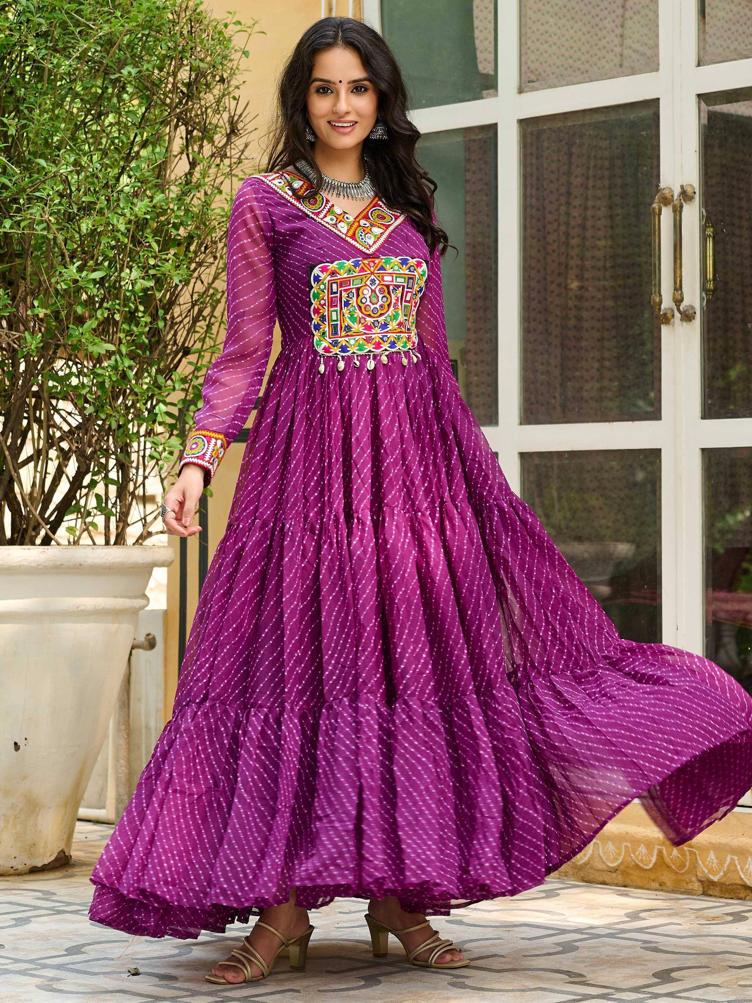 Purple ethnic gown with colorful embroidery and tiered skirt, perfect for Indian festive wear