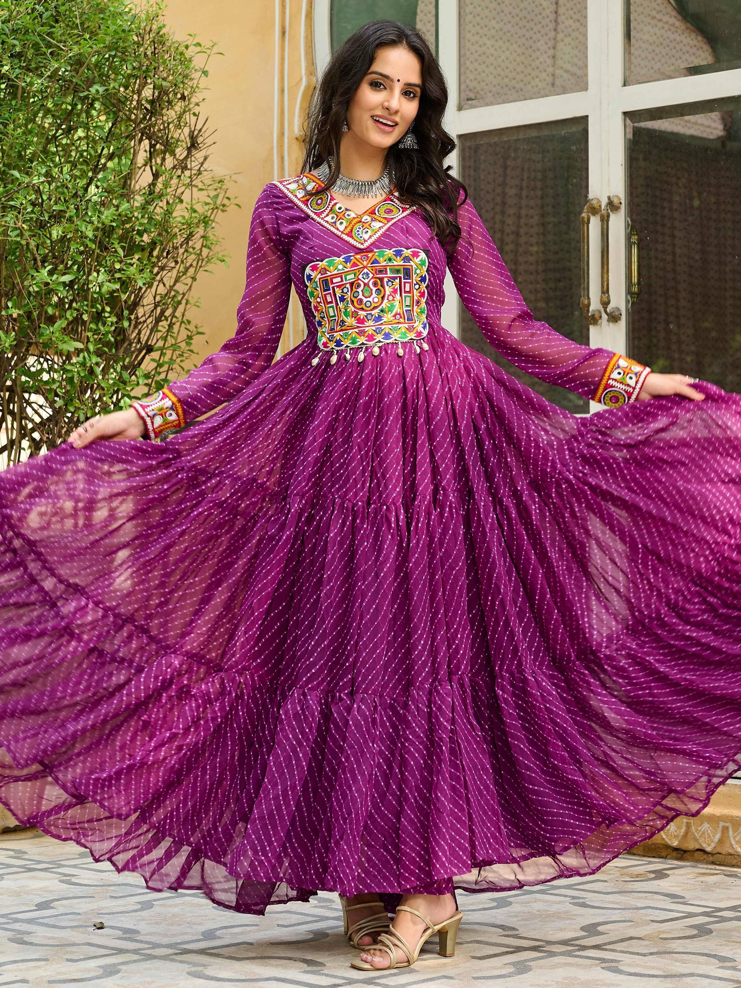 Purple ethnic gown with colorful embroidery and flared skirt for festive occasions