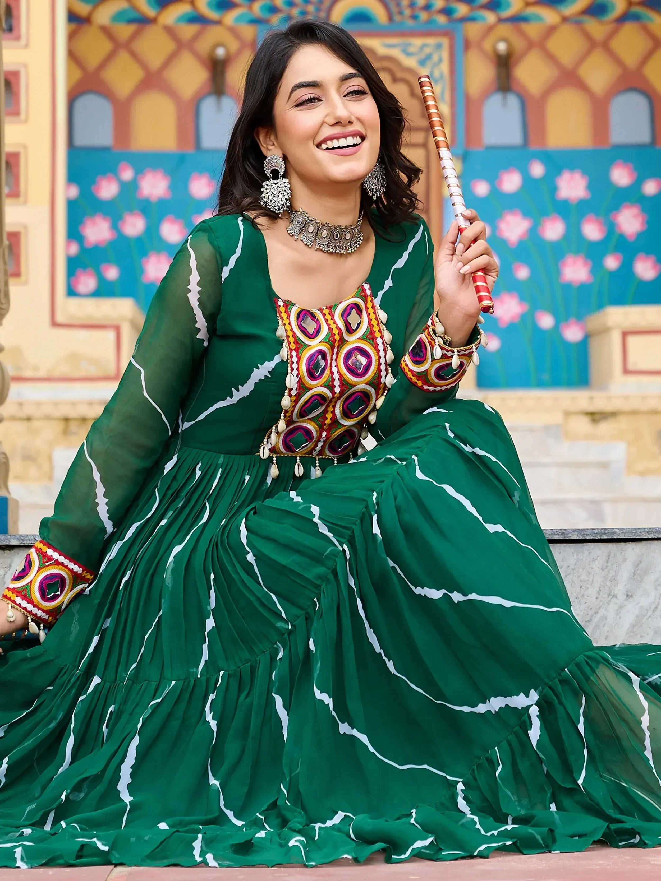 Green ethnic gown with mirror work, perfect for Indian festive occasions and traditional events.