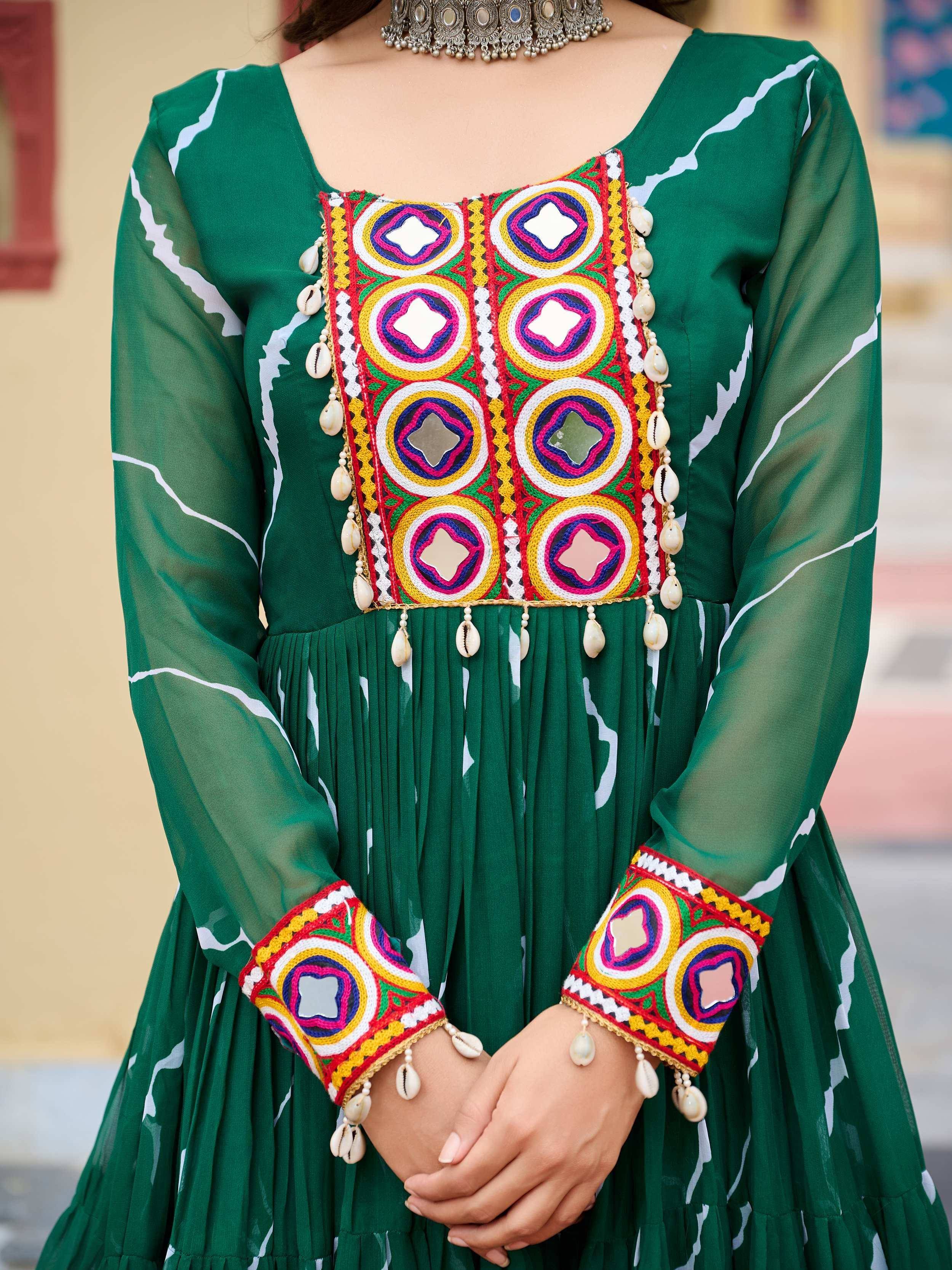 Green ethnic gown with colorful mirror work, embroidery, and shell embellishments for women