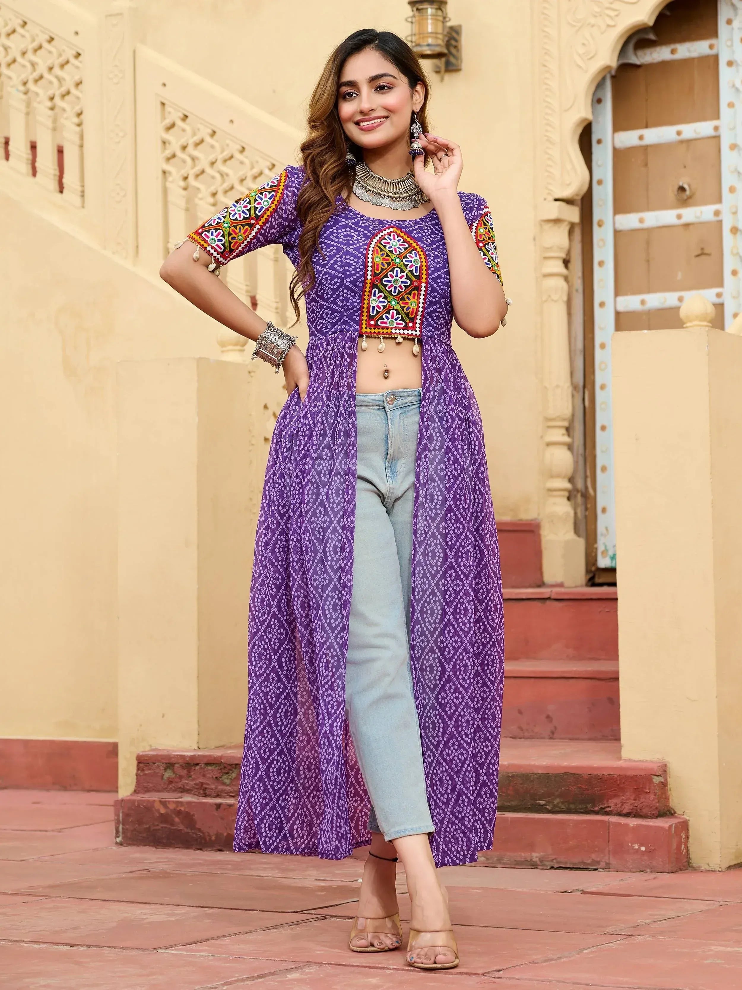 Purple embroidered ethnic kurta with jeans, perfect for Indian festive wear and casual occasions.