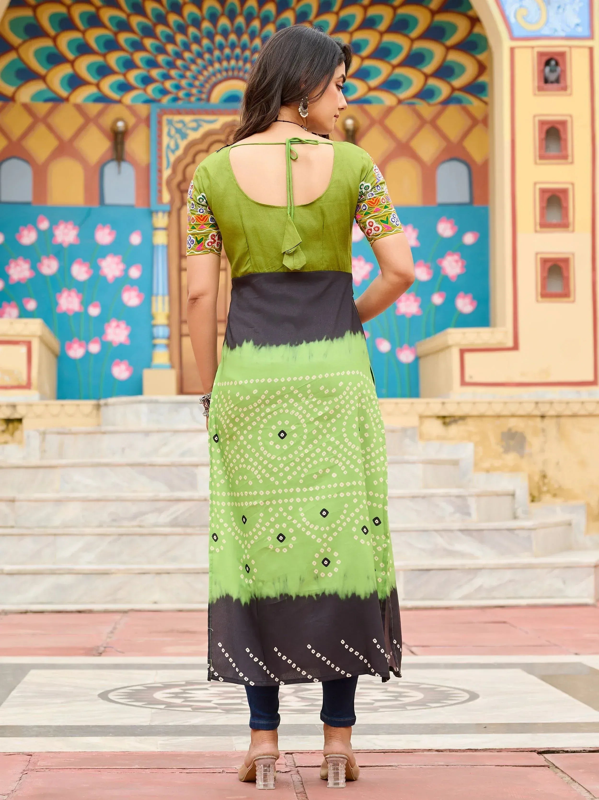 Green and black printed ethnic kurti with floral embroidery and tie-back detail