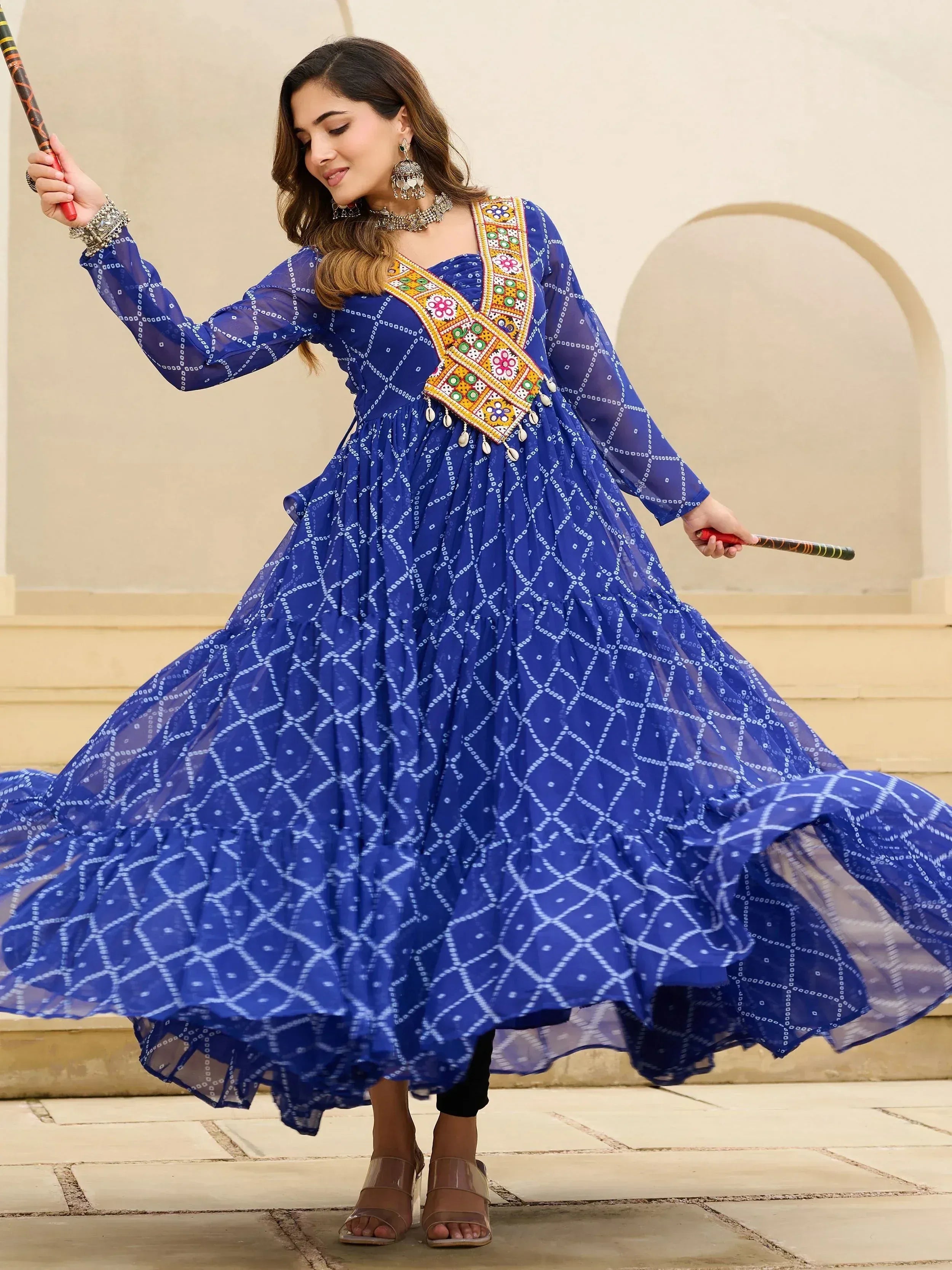 Blue ethnic gown with floral embroidery and geometric print, perfect for festive occasions.