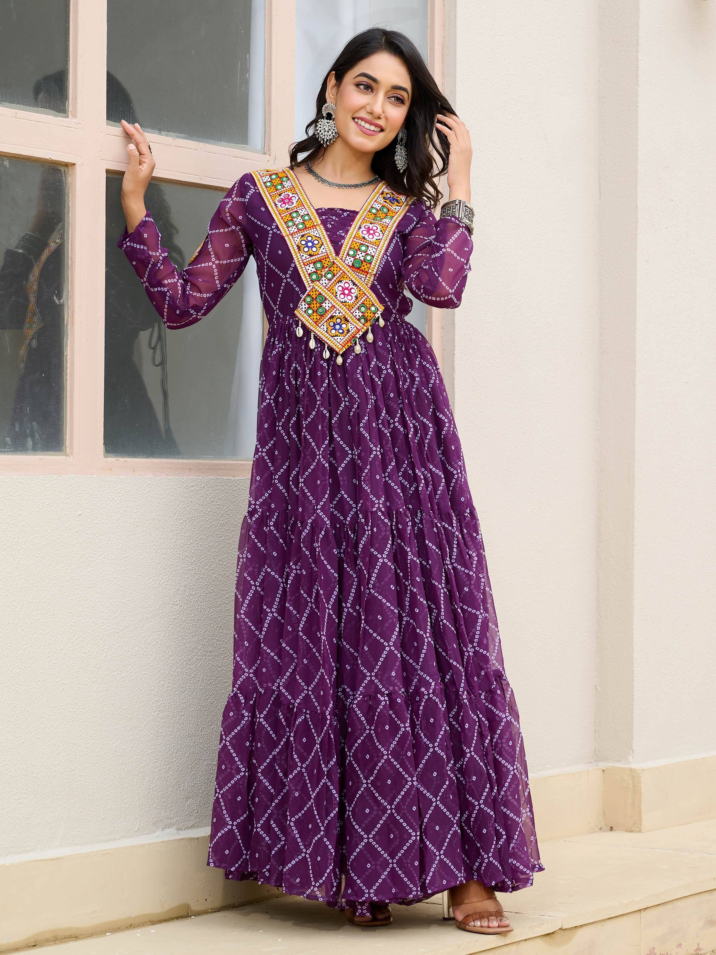 Purple ethnic gown with mirror work and bandhani print, perfect for Indian occasions