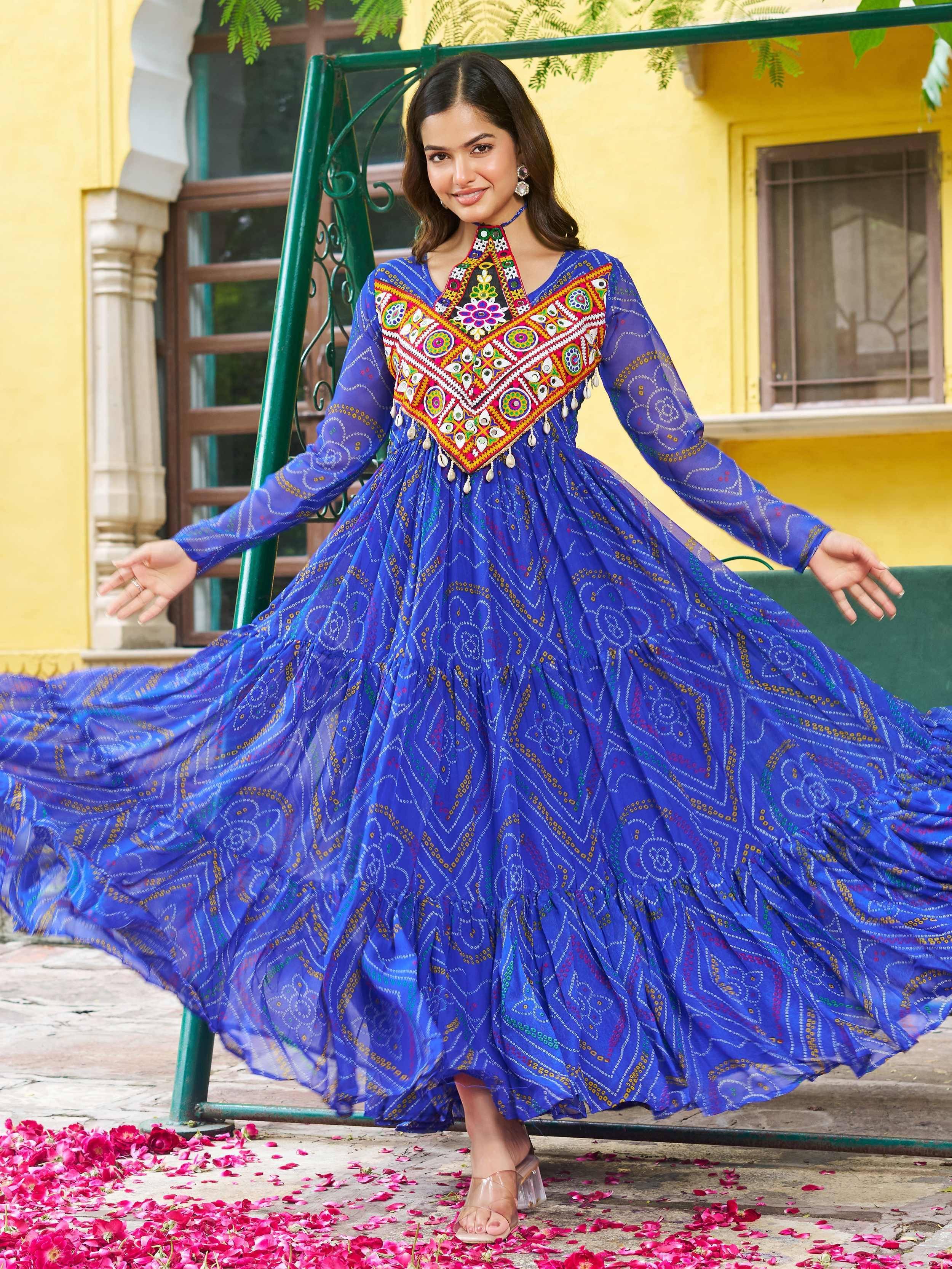 Blue ethnic gown with colorful mirror work and floral embroidery, perfect for Indian festive occasions.