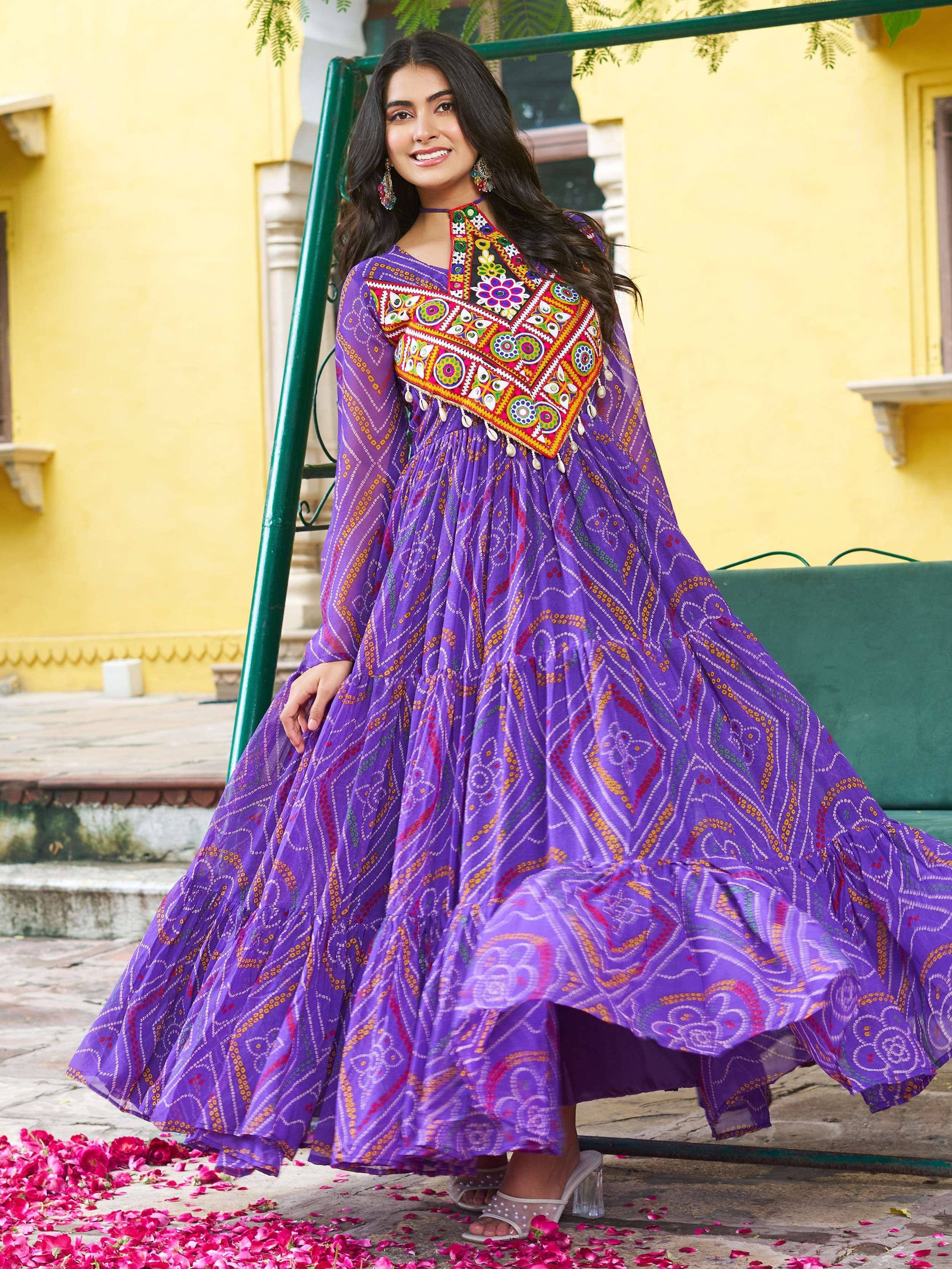 Purple embroidered ethnic gown with mirror work, perfect for Indian festivals and occasions