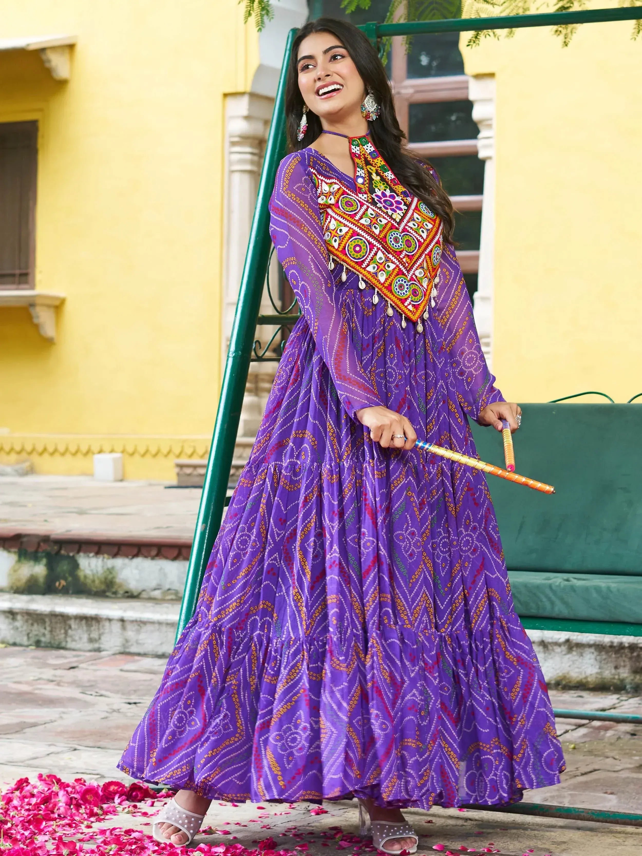 Purple ethnic gown with colorful mirror work, perfect for festive occasions and Indian celebrations.