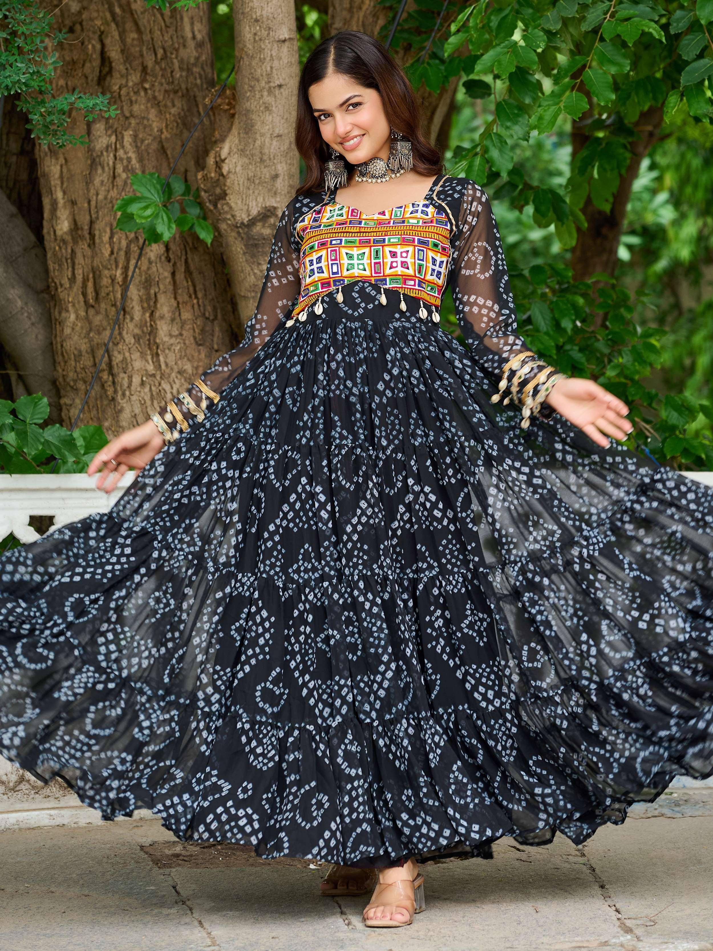 Woman in black and white printed ethnic gown with colorful embroidered top, perfect for Indian festive occasions