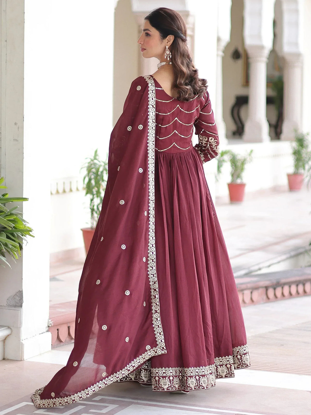 Maroon ethnic anarkali suit with gold embroidery and dupatta, perfect for Indian weddings and festivals