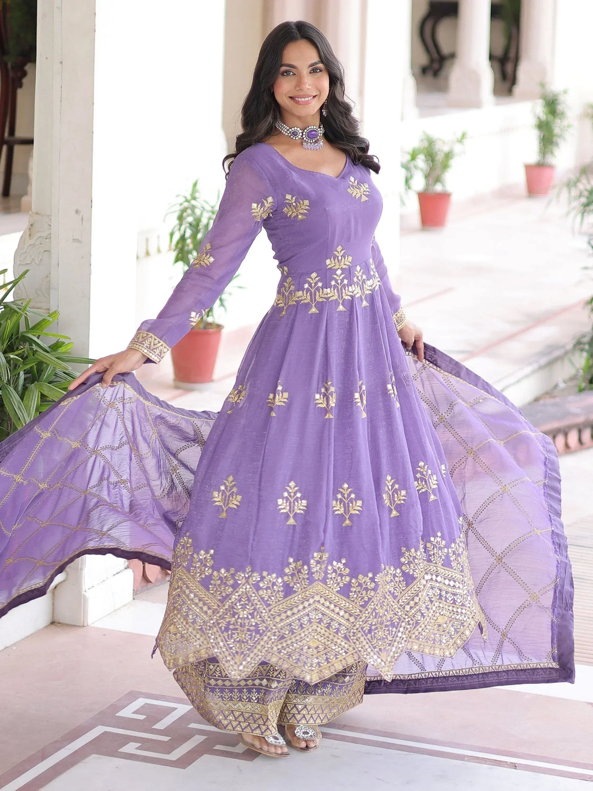 Purple ethnic gown with gold embroidery, perfect for Indian occasions and festive wear
