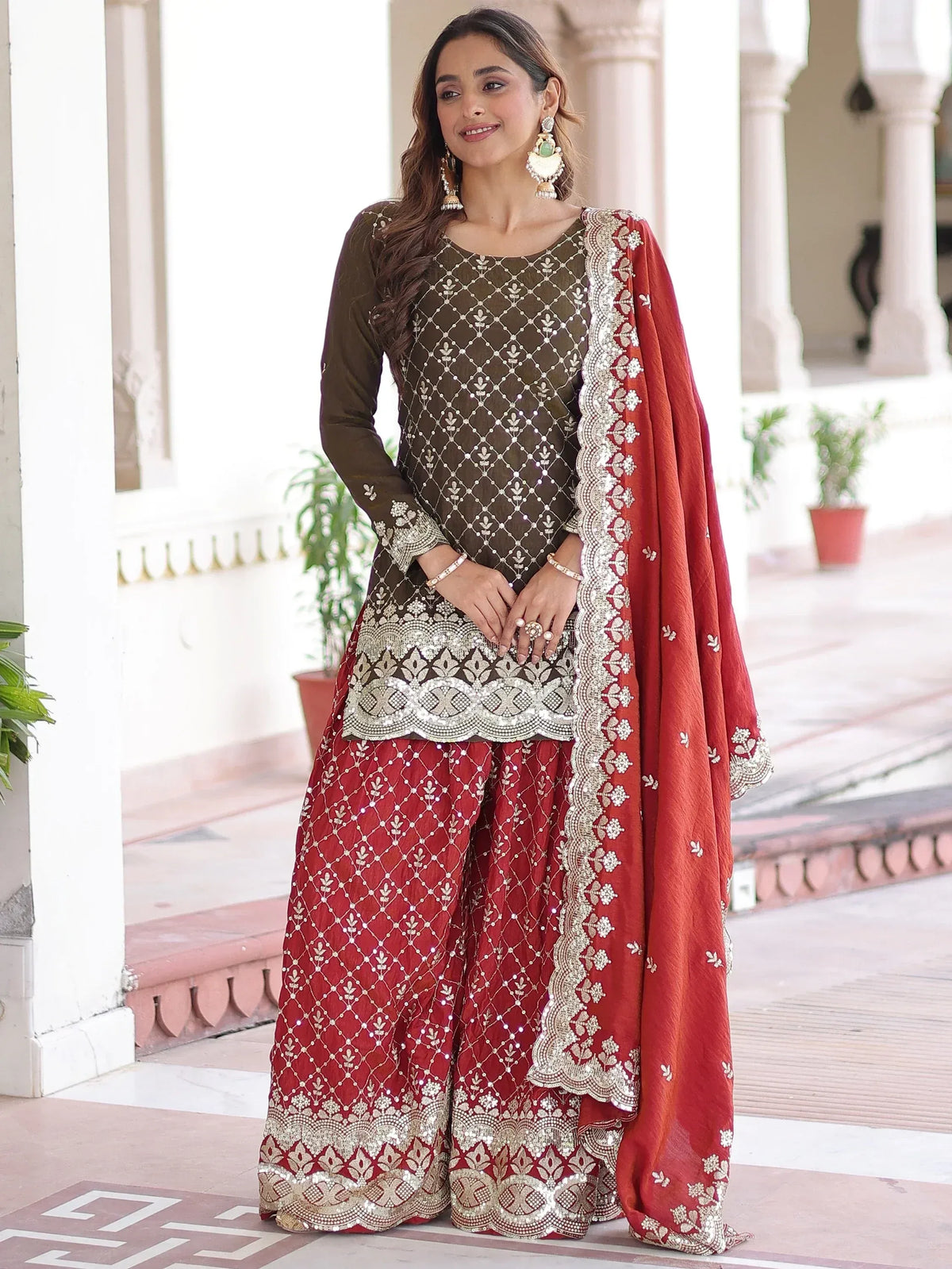 Elegant red and olive green embroidered salwar kameez with matching dupatta, perfect for festive occasions.
