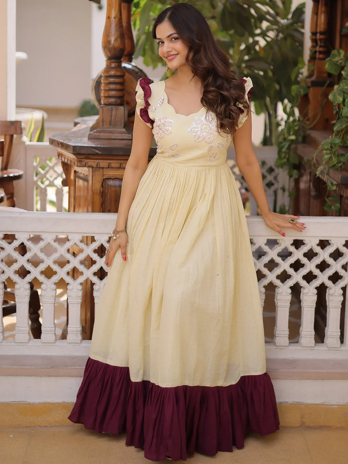Cream and maroon ethnic gown with floral embroidery and ruffled sleeves for women
