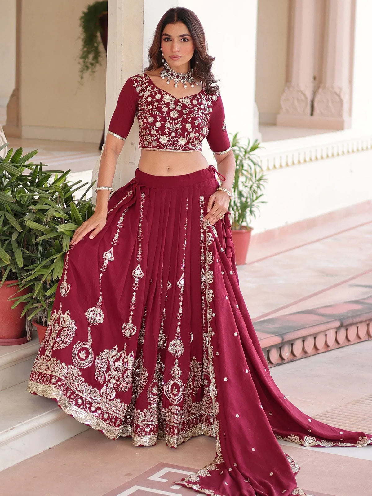 Maroon embroidered lehenga choli with gold detailing, perfect for Indian ethnic wear and festive occasions.