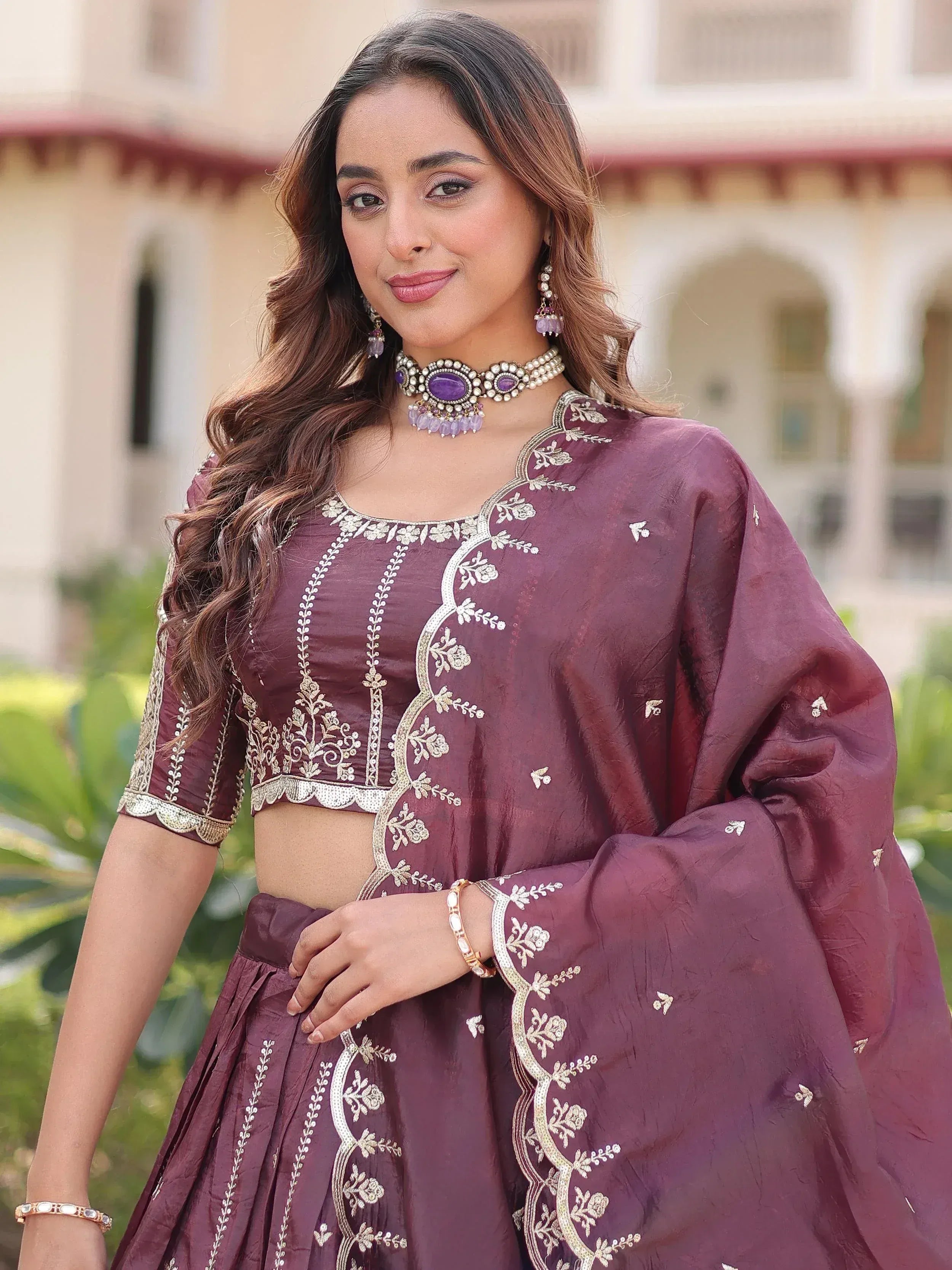 Elegant maroon lehenga choli with gold embroidery, perfect for Indian ethnic wear occasions.