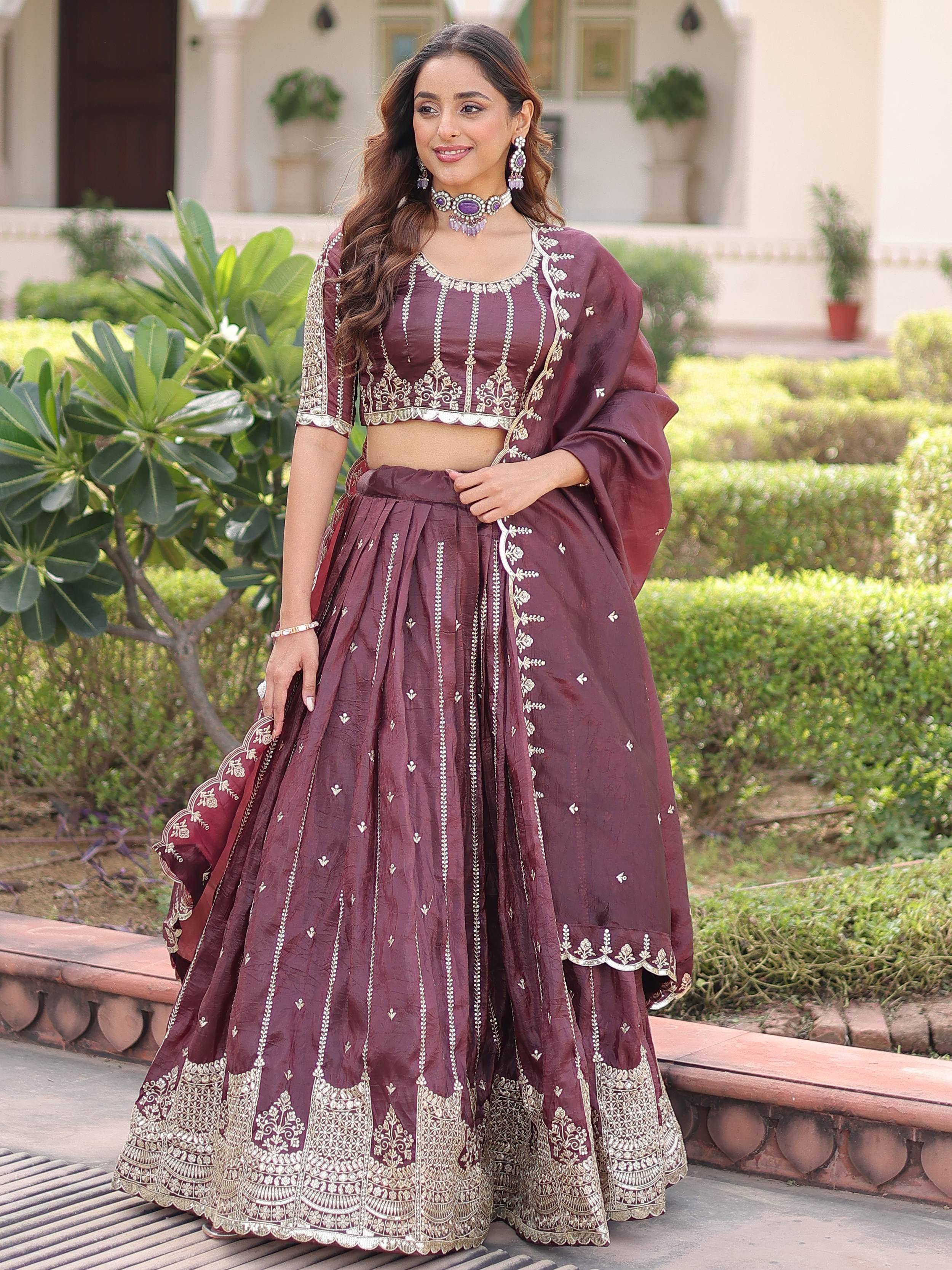 Burgundy embroidered lehenga choli with gold detailing, perfect for Indian ethnic wear occasions